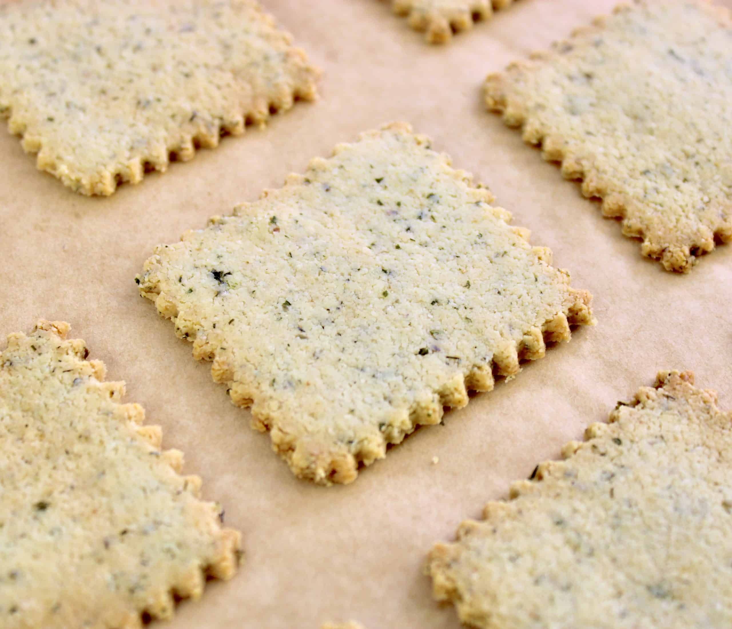 closeup of baked ranch crackers on parchment paper
