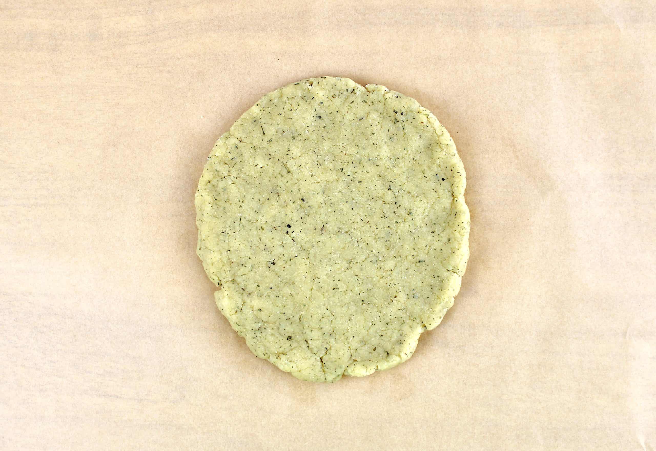 Keto Ranch Crackers dough in disc on parchment paper