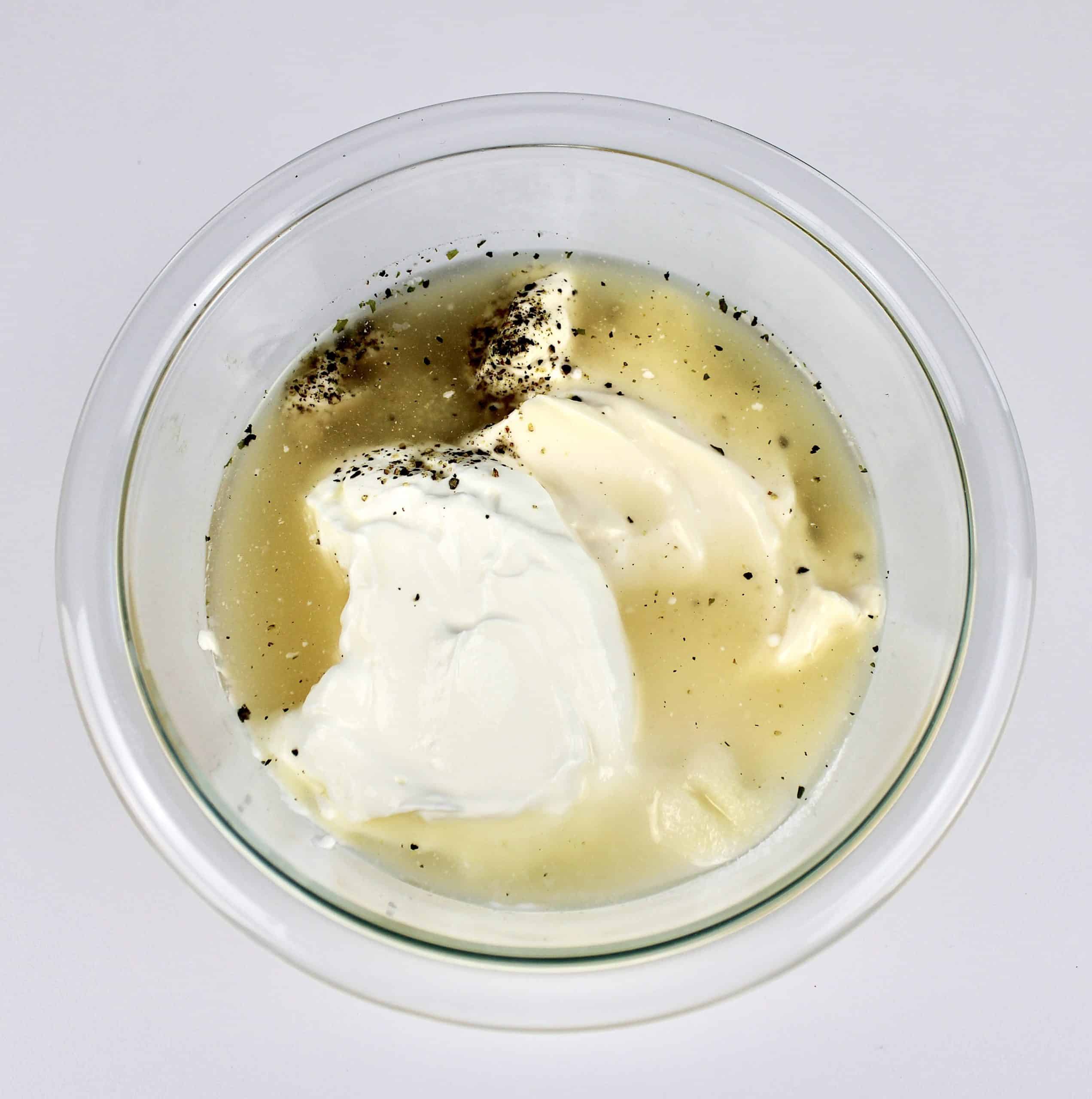 sour cream mayonnaise vinegar and spices in bowl unmixed