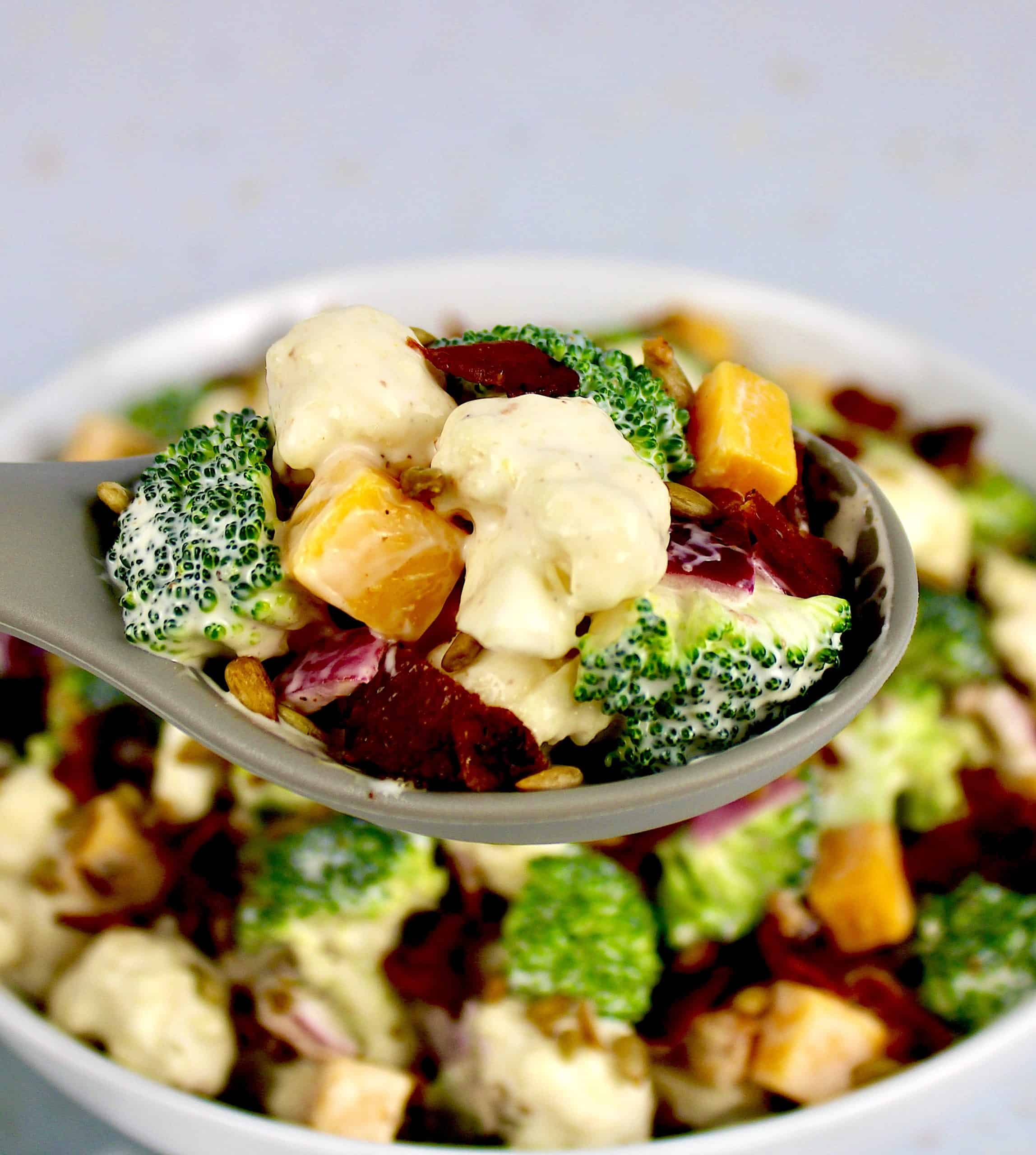 closeup of Broccoli Cauliflower Salad in spoon
