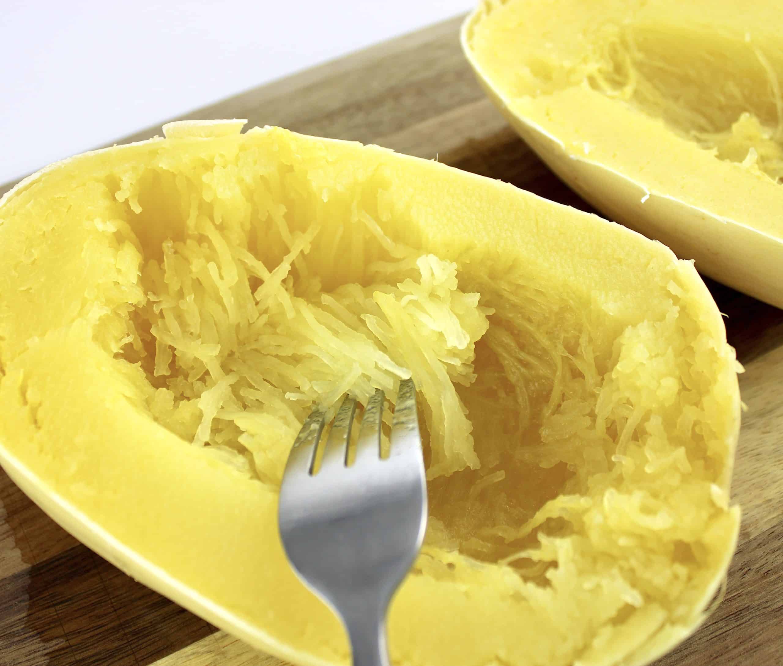 spaghetti squash strands being separated with fork