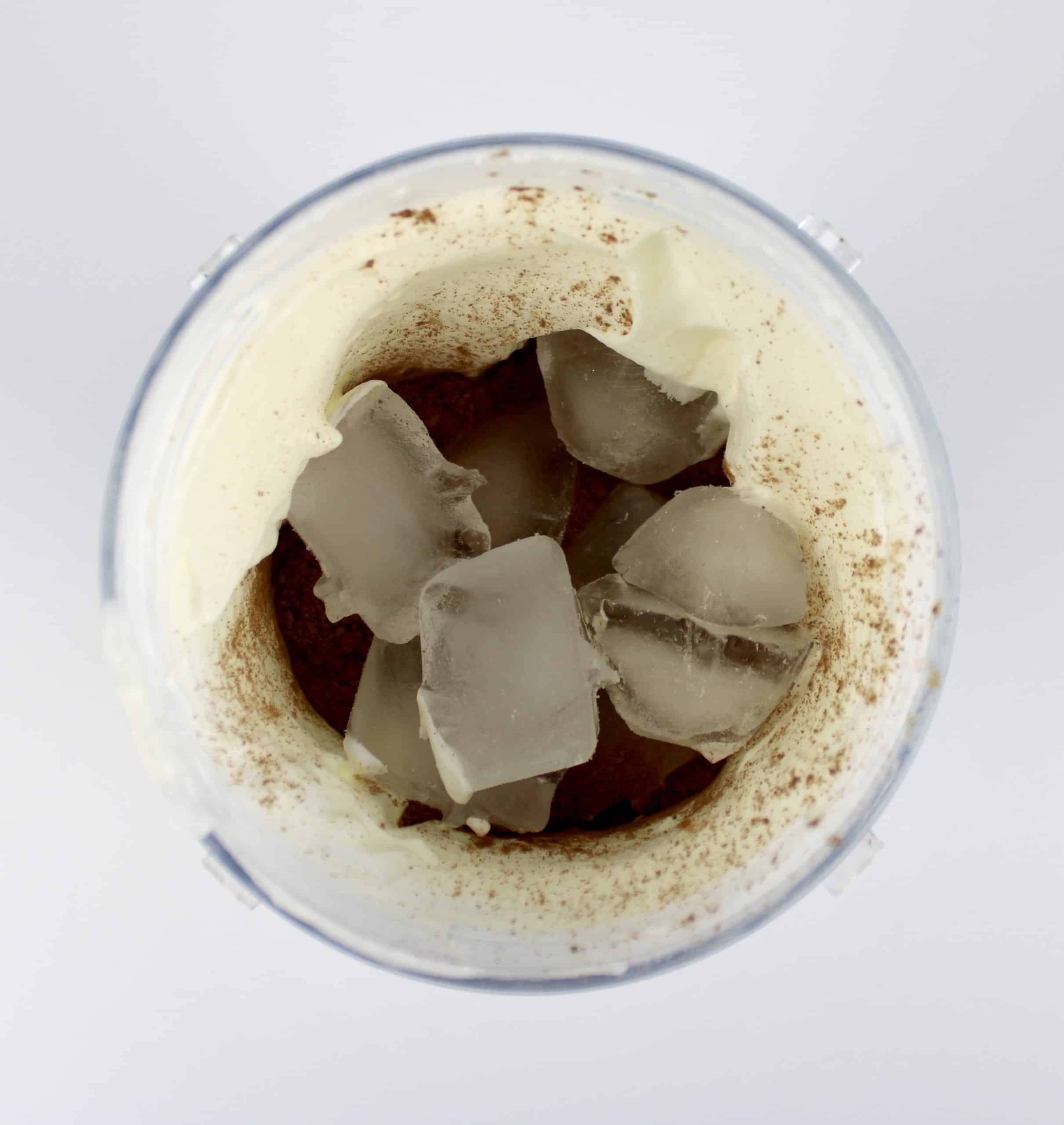 chocolate milkshake ingredients with ice in bullet blender