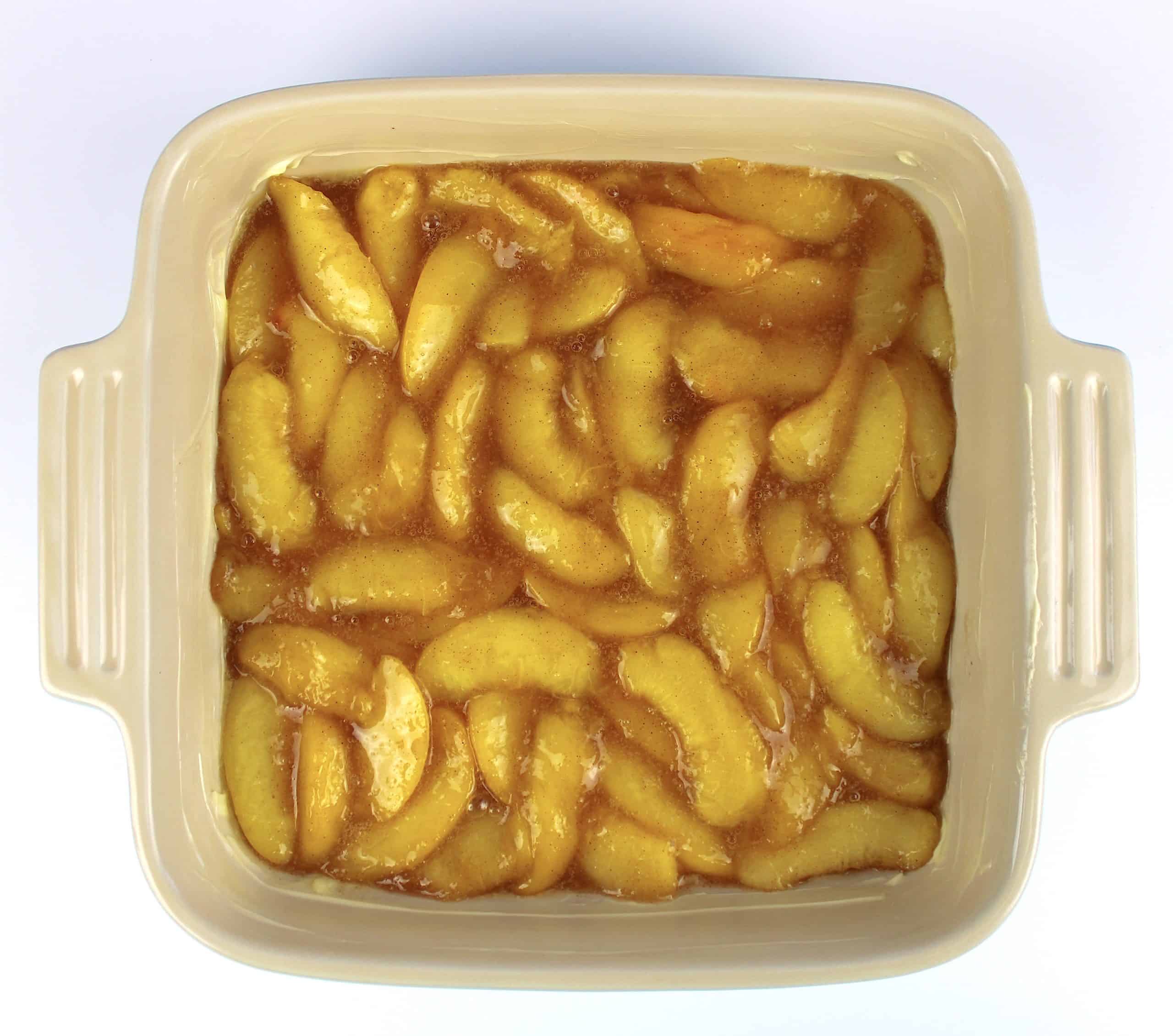 cooked peach slices in baking dish