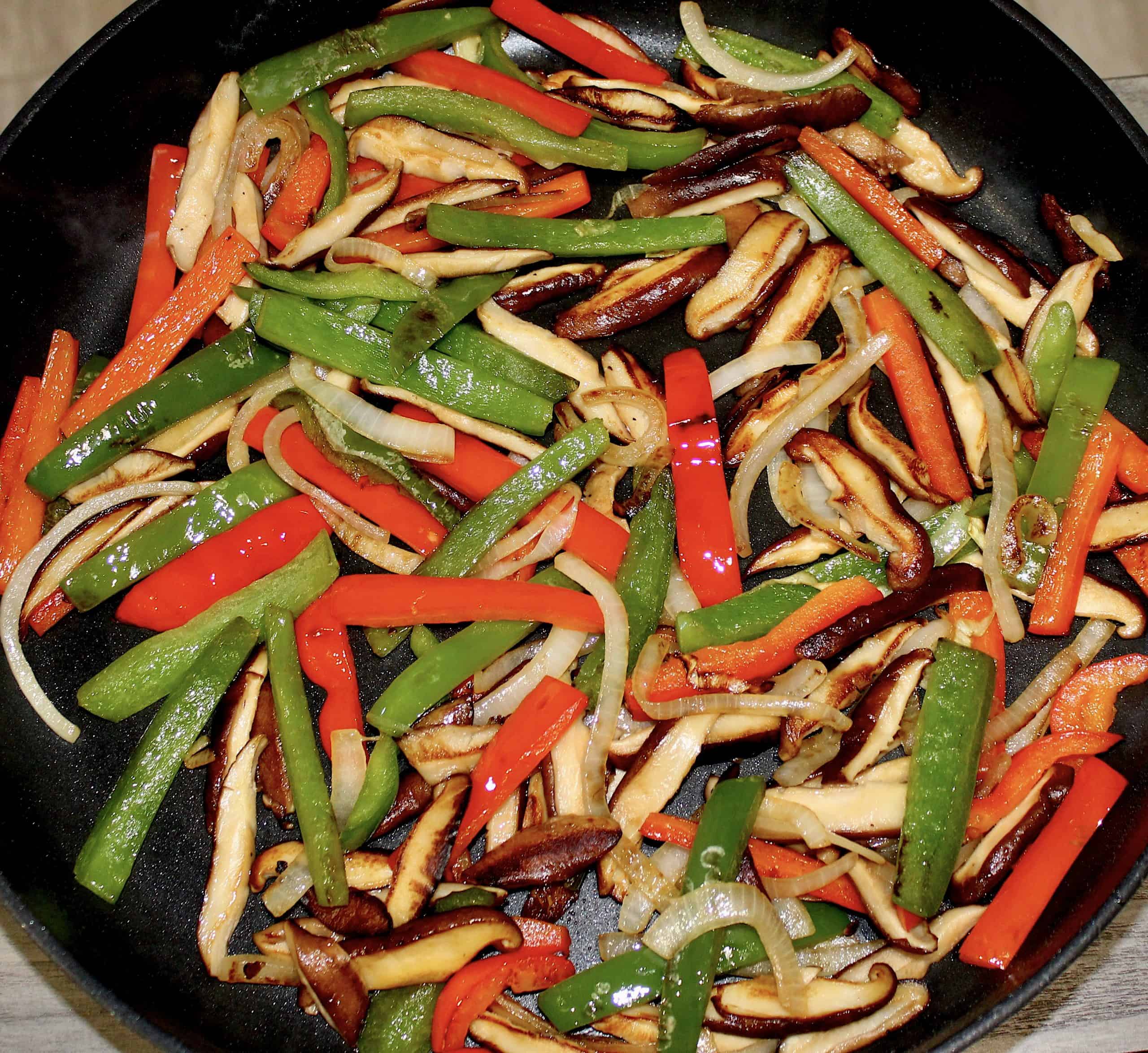 Sauteed mushrooms onions and peppers in slkillet
