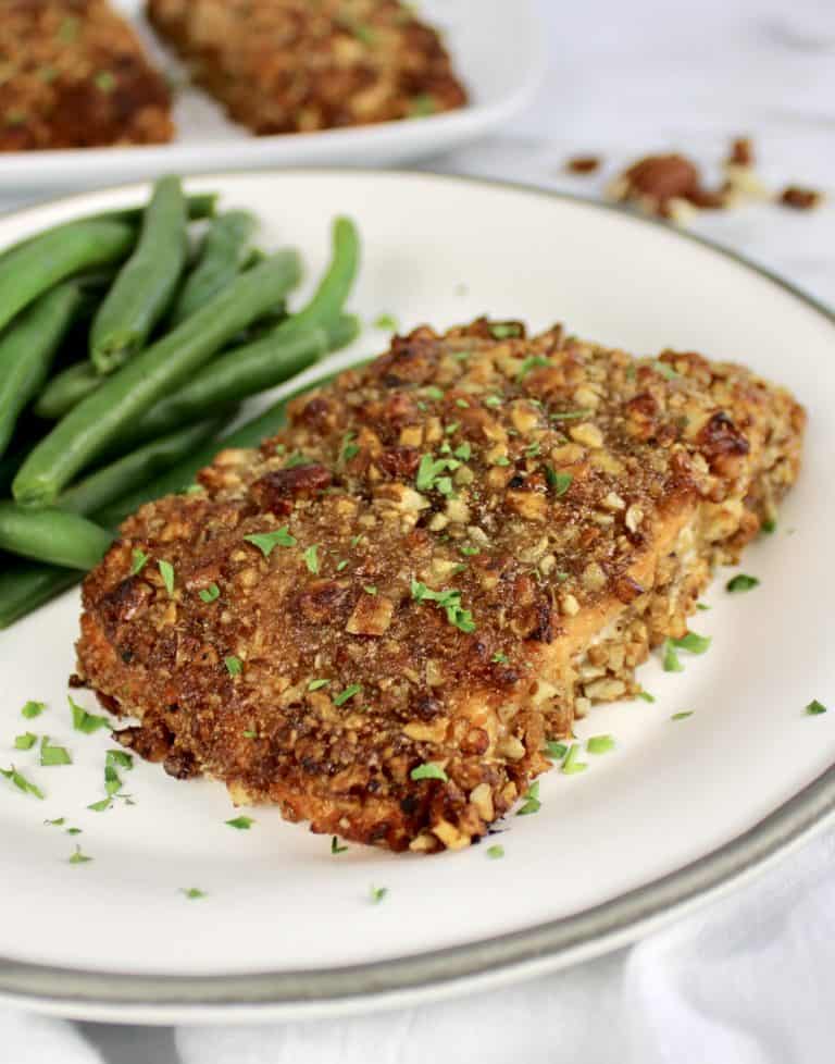 Pecan Crusted Salmon in white plate with green beans