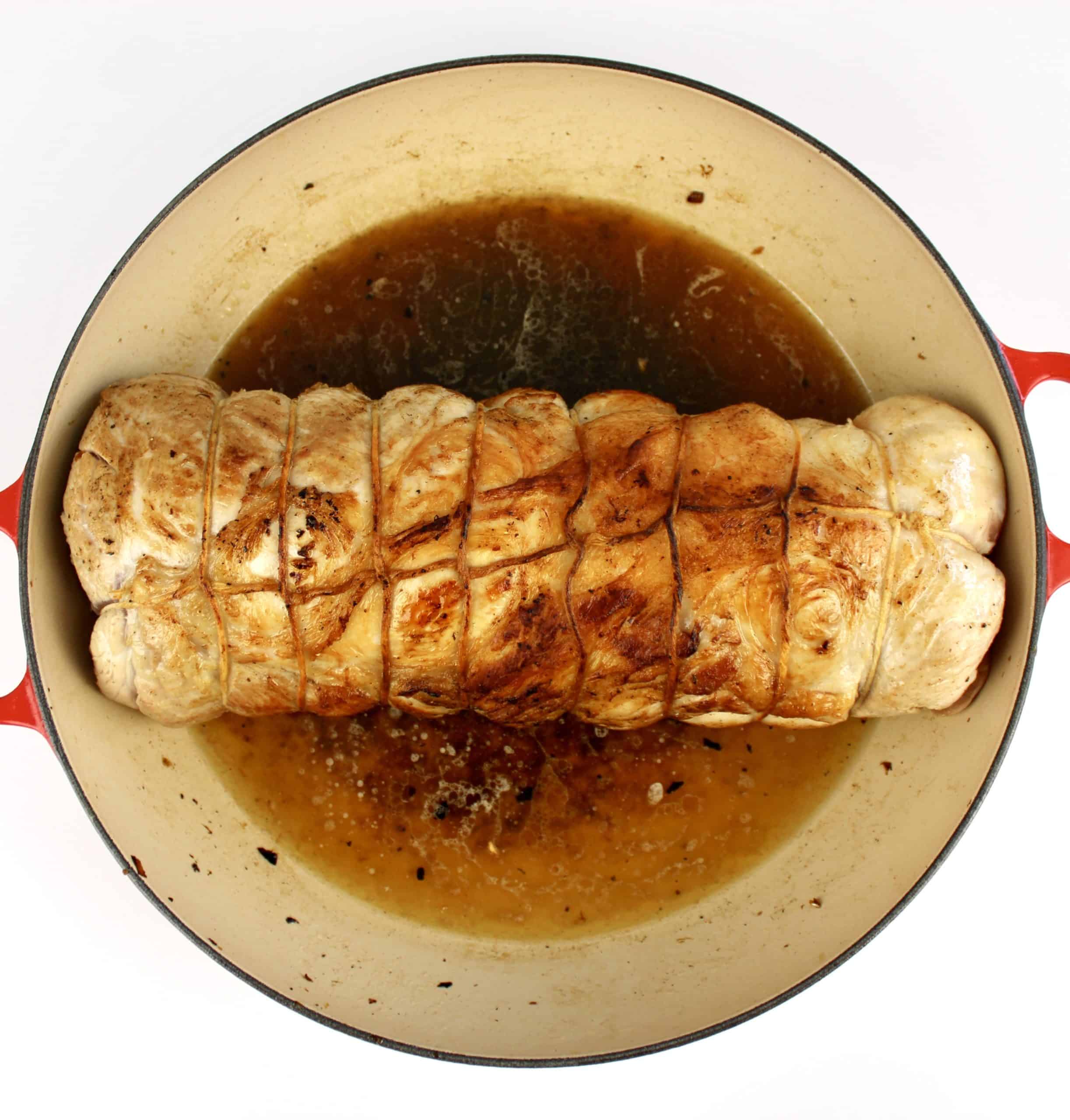 Stuffed Pork Loin in pot with chicken broth