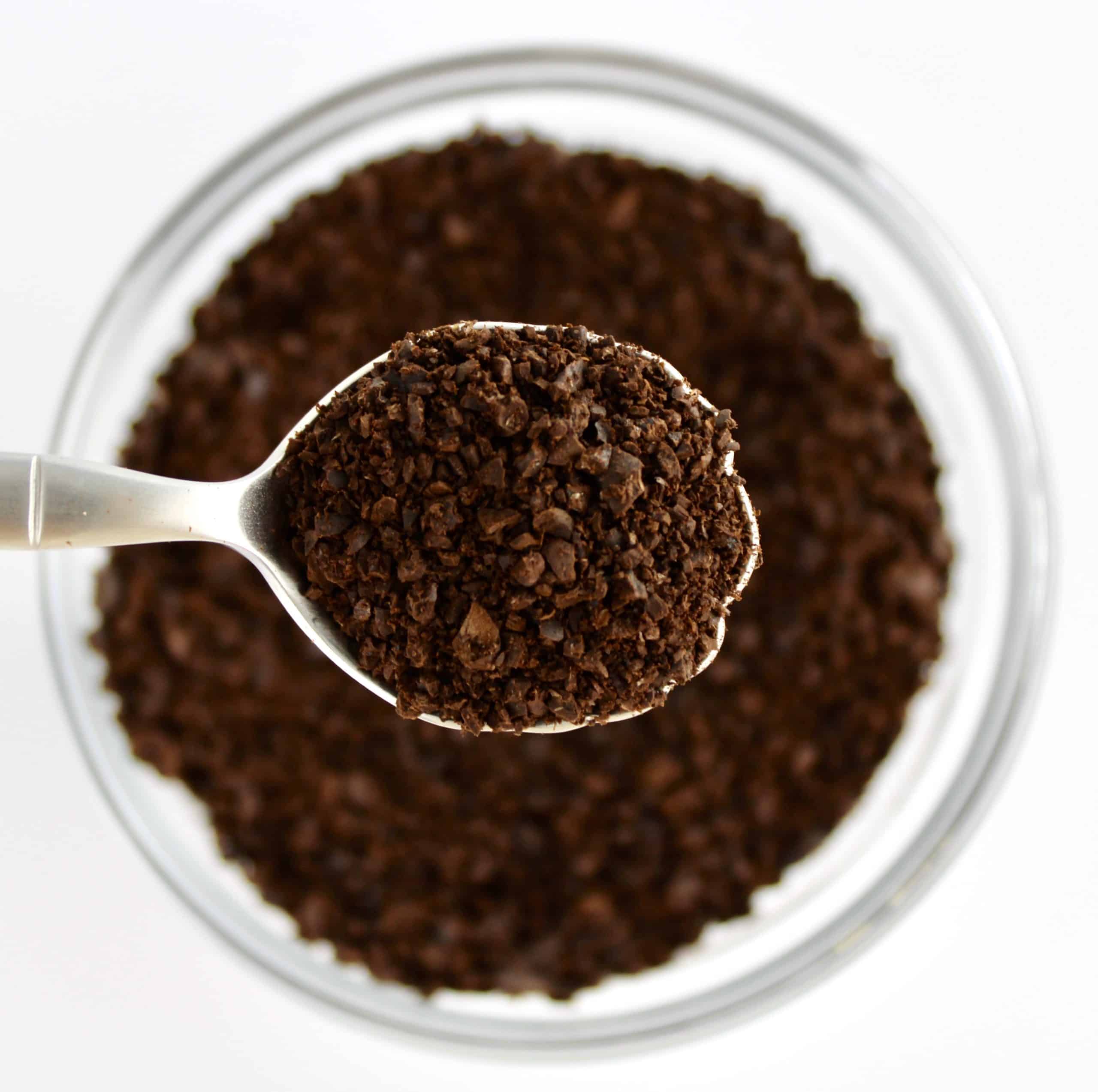 ground coffee in spoon