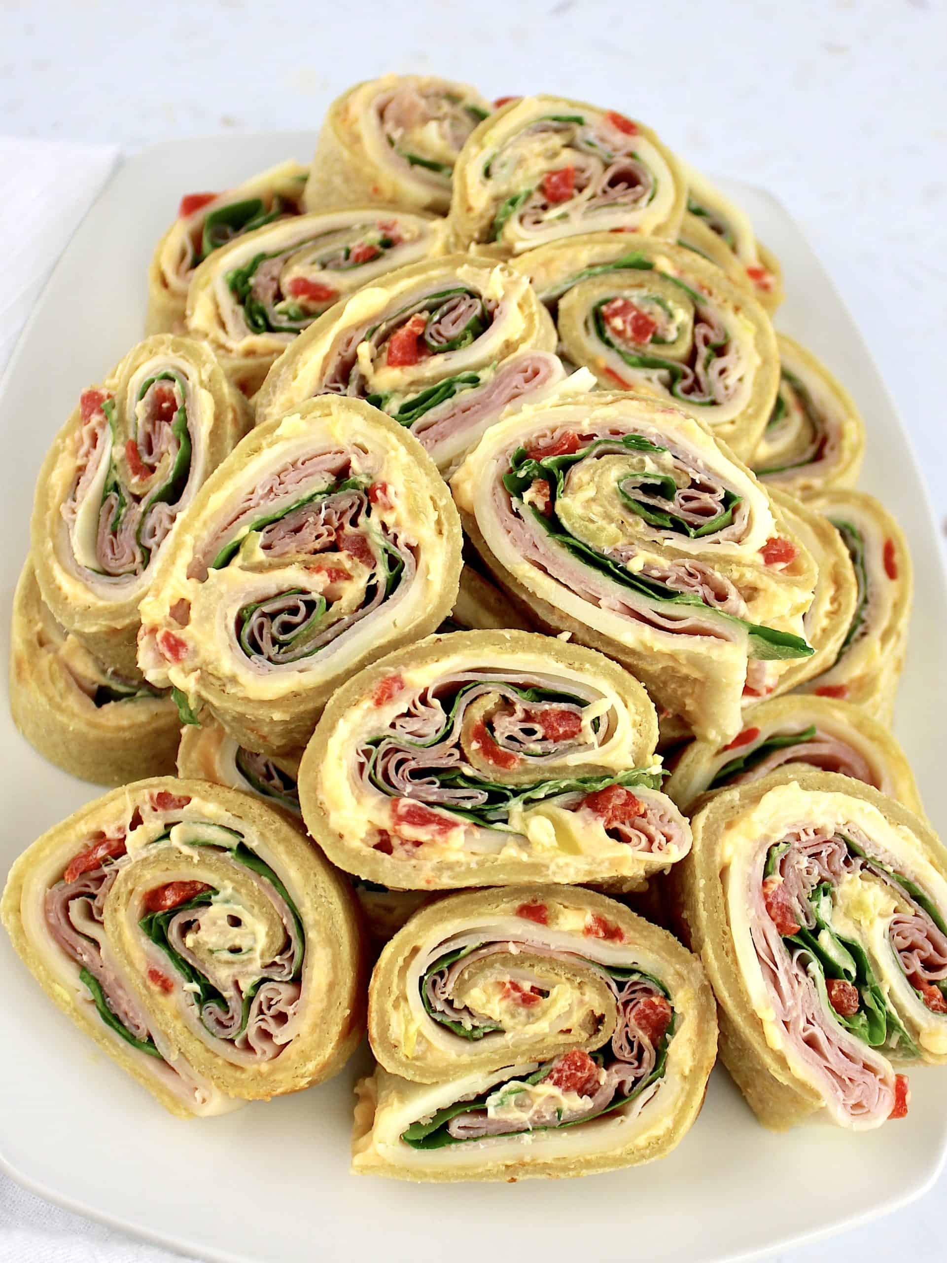 white platter with Italian pinwheels stacked up