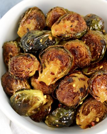 Honey Roasted Brussels Sprouts in white bowl