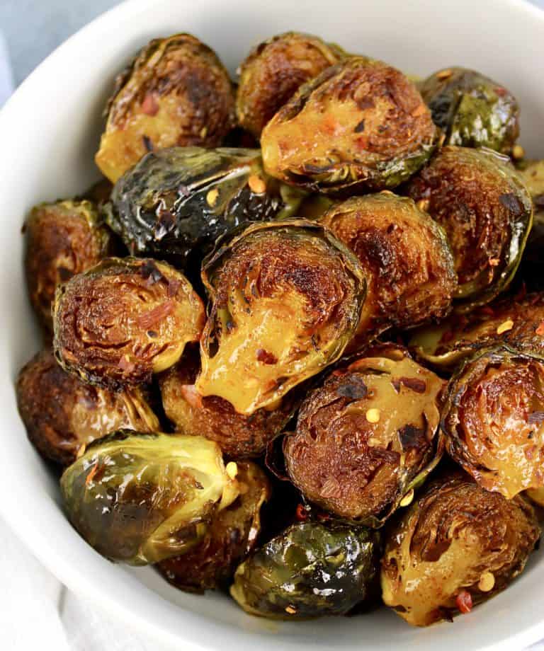 Honey Roasted Brussels Sprouts in white bowl
