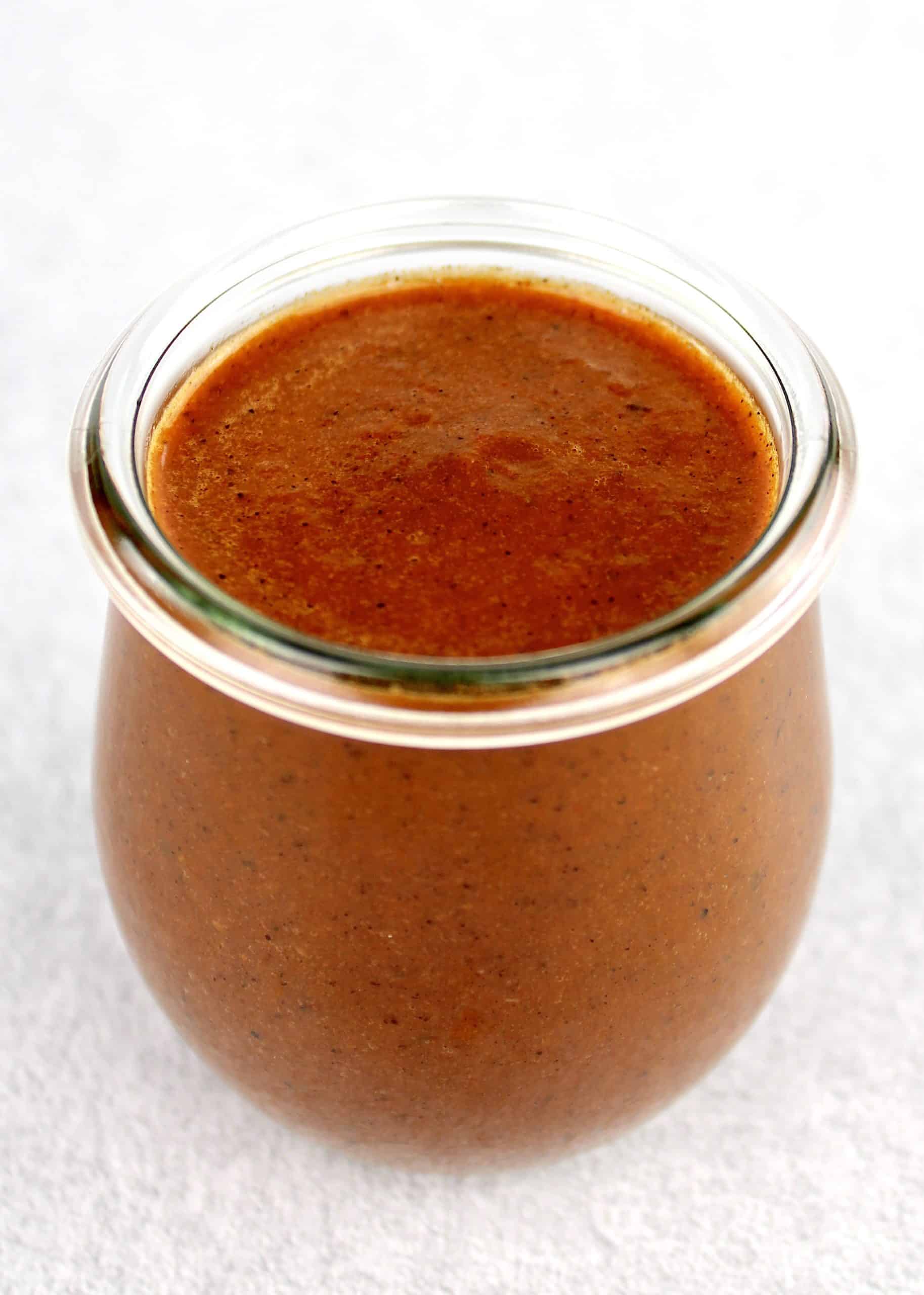 Keto Enchilada Sauce in open glass jar