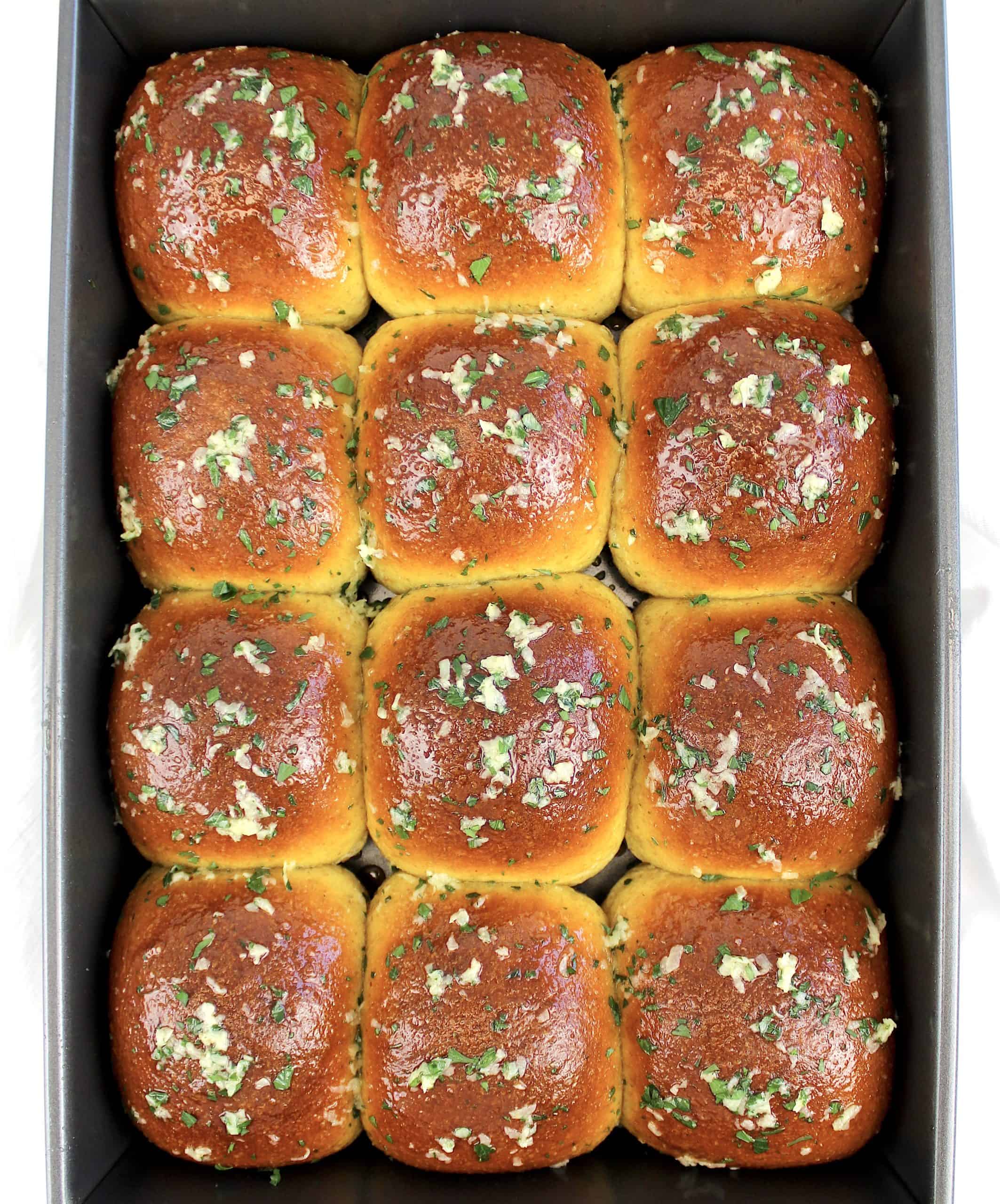 12 baked garlic rolls with garlic and parmesan on top
