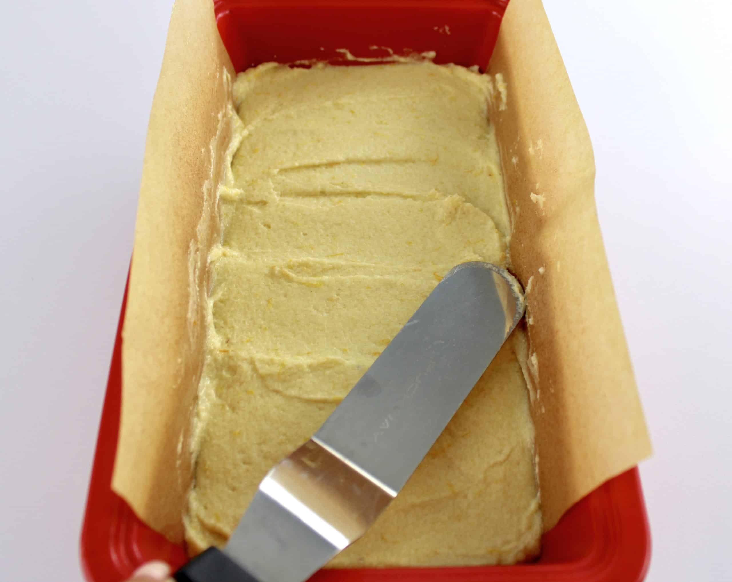Keto Orange Pound Cake batter being spread into loaf pan