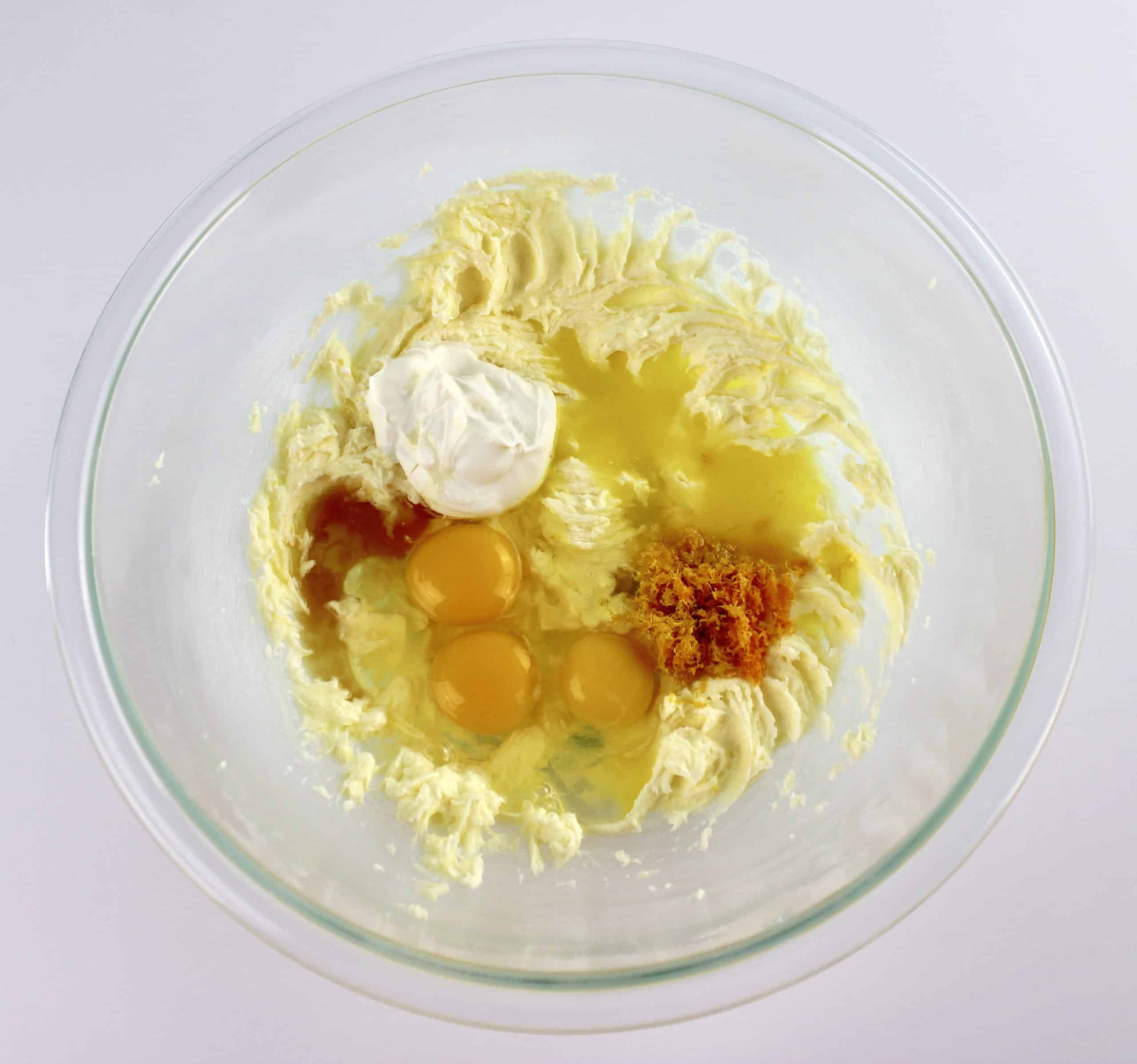 wet ingredients for orange pound cake in glass bowl