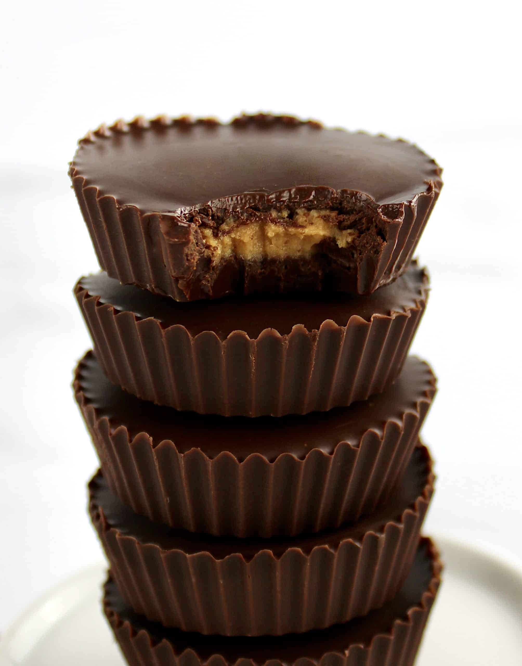 Keto Peanut Butter Cups stacked with bite missing from the top one