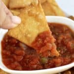 Keto Tortilla Chip being dipped into salsa