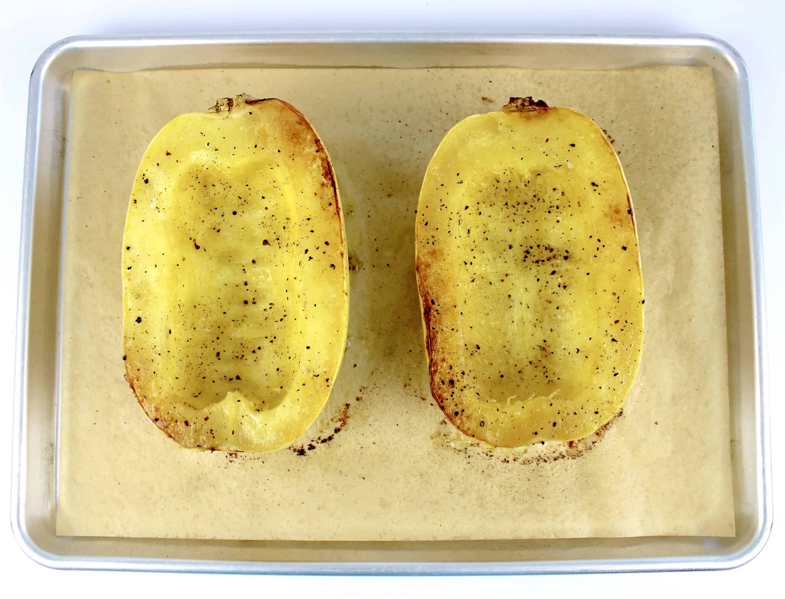 roasted spaghetti squash on baking sheet with parchment paper