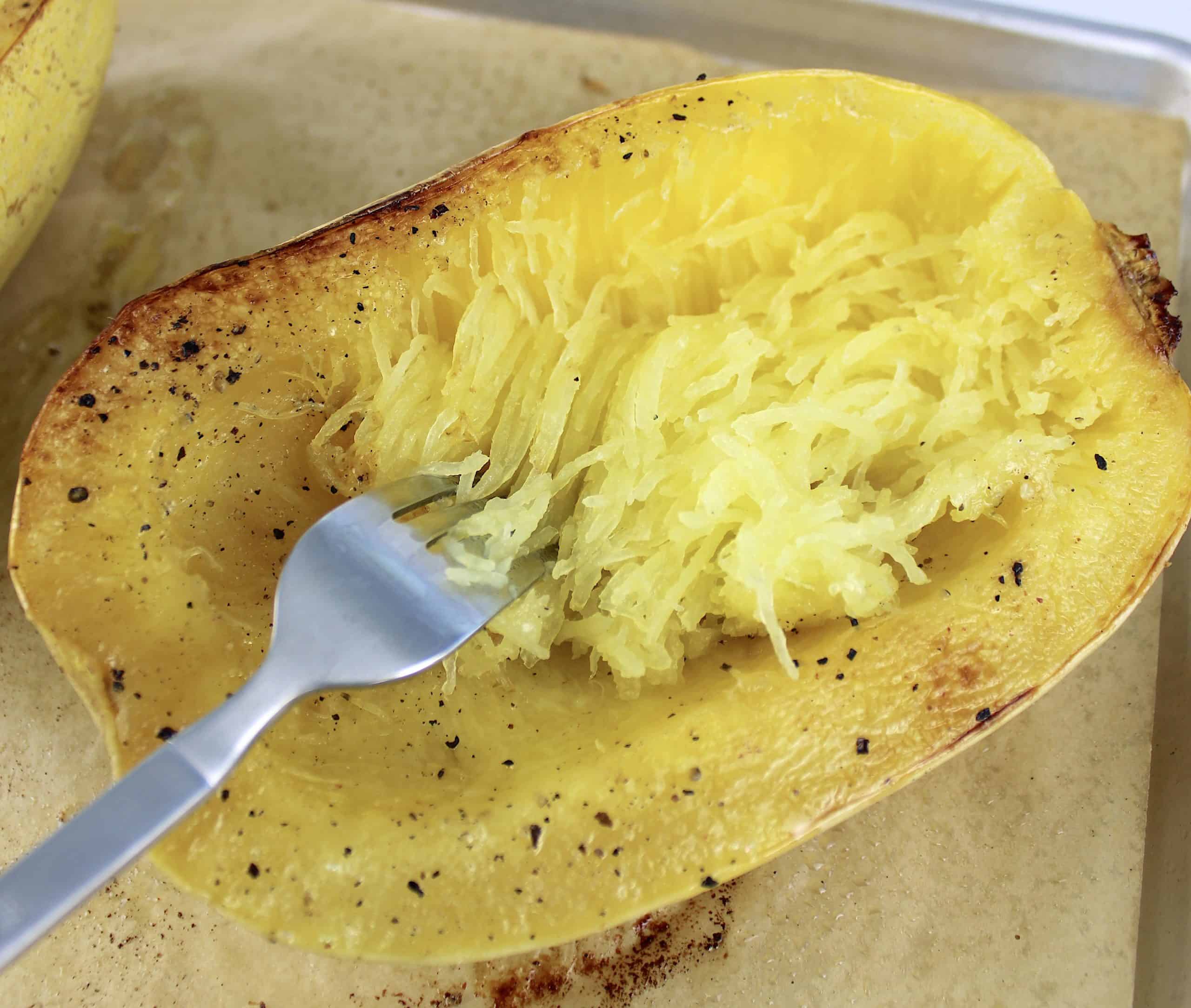 spaghetti squash being scraped with fork