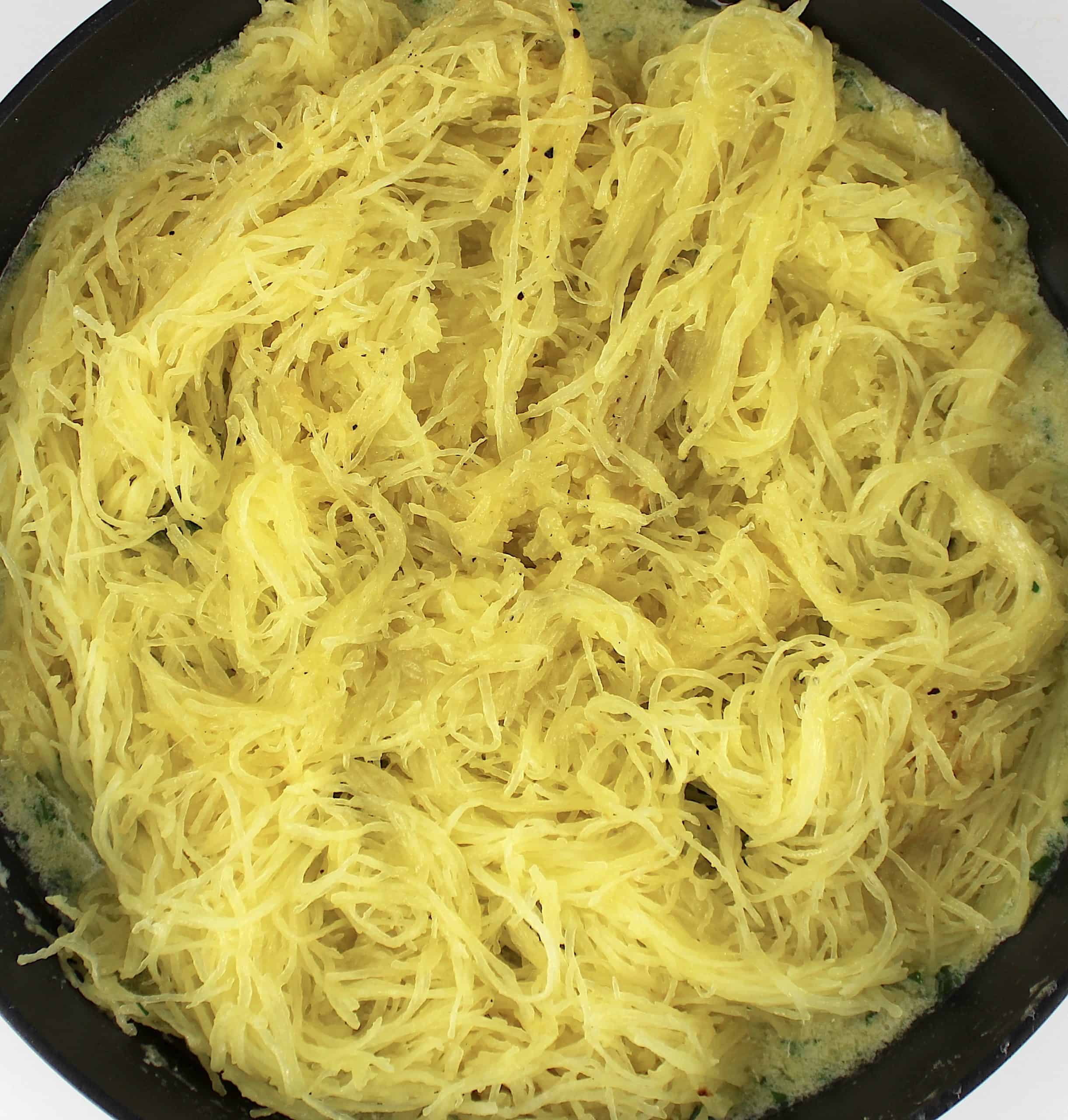 spaghetti squash in butter sauce in skillet