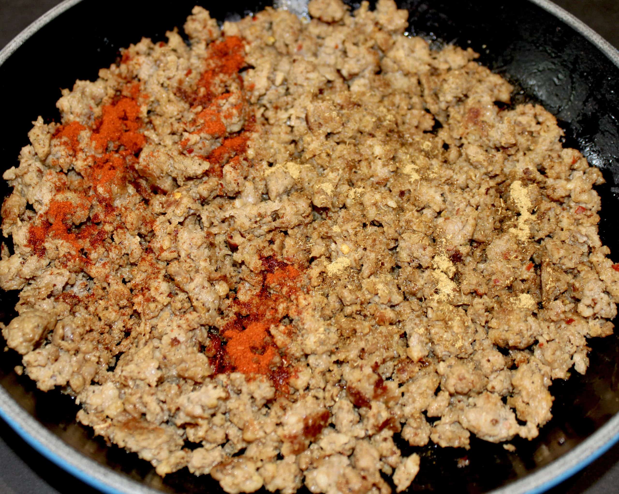 browned ground sausage with spices cooking in skillet