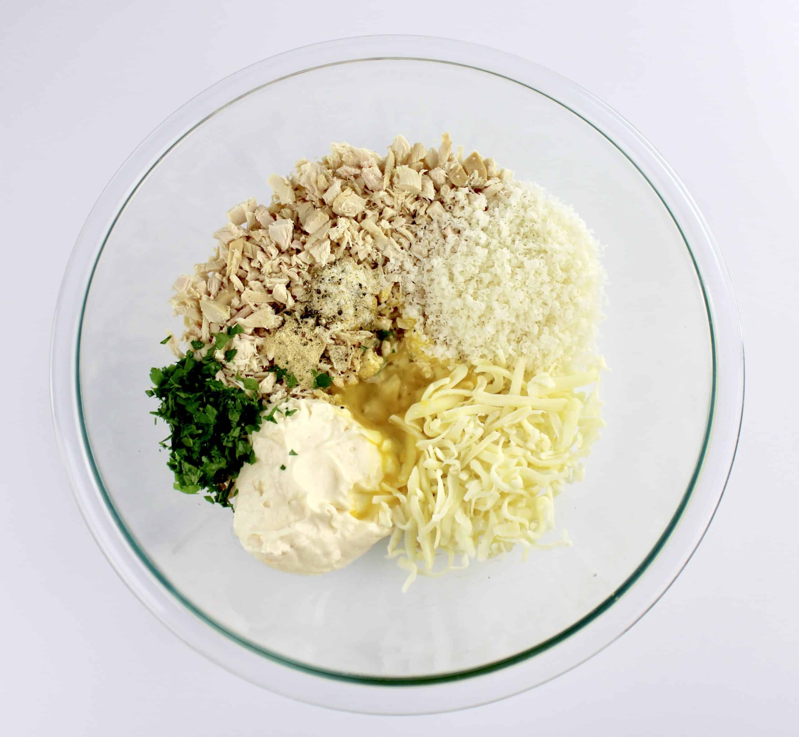 chicken patties ingredients in glass bowl unmixed