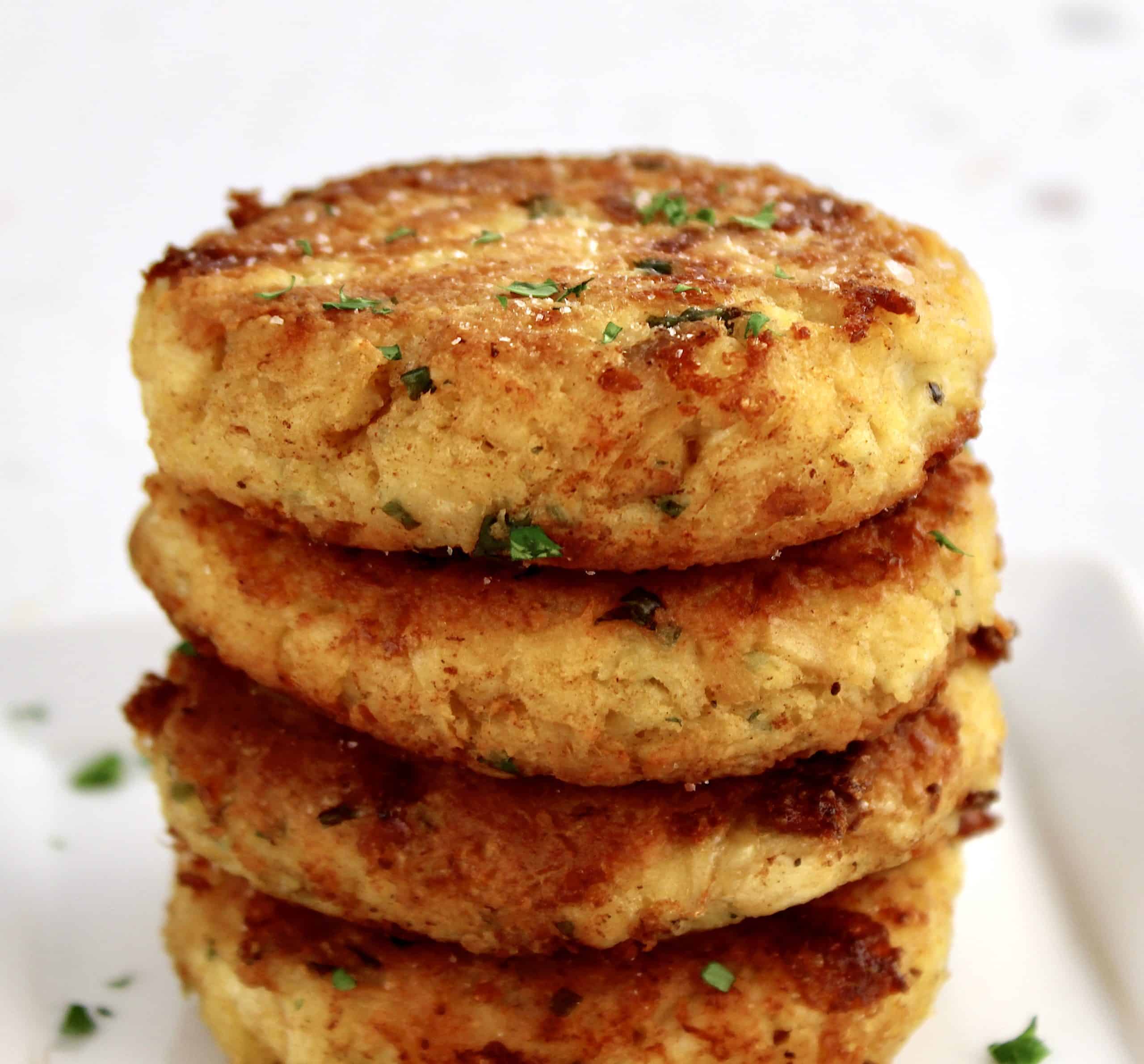 stack of 4 chicken patties on white plate