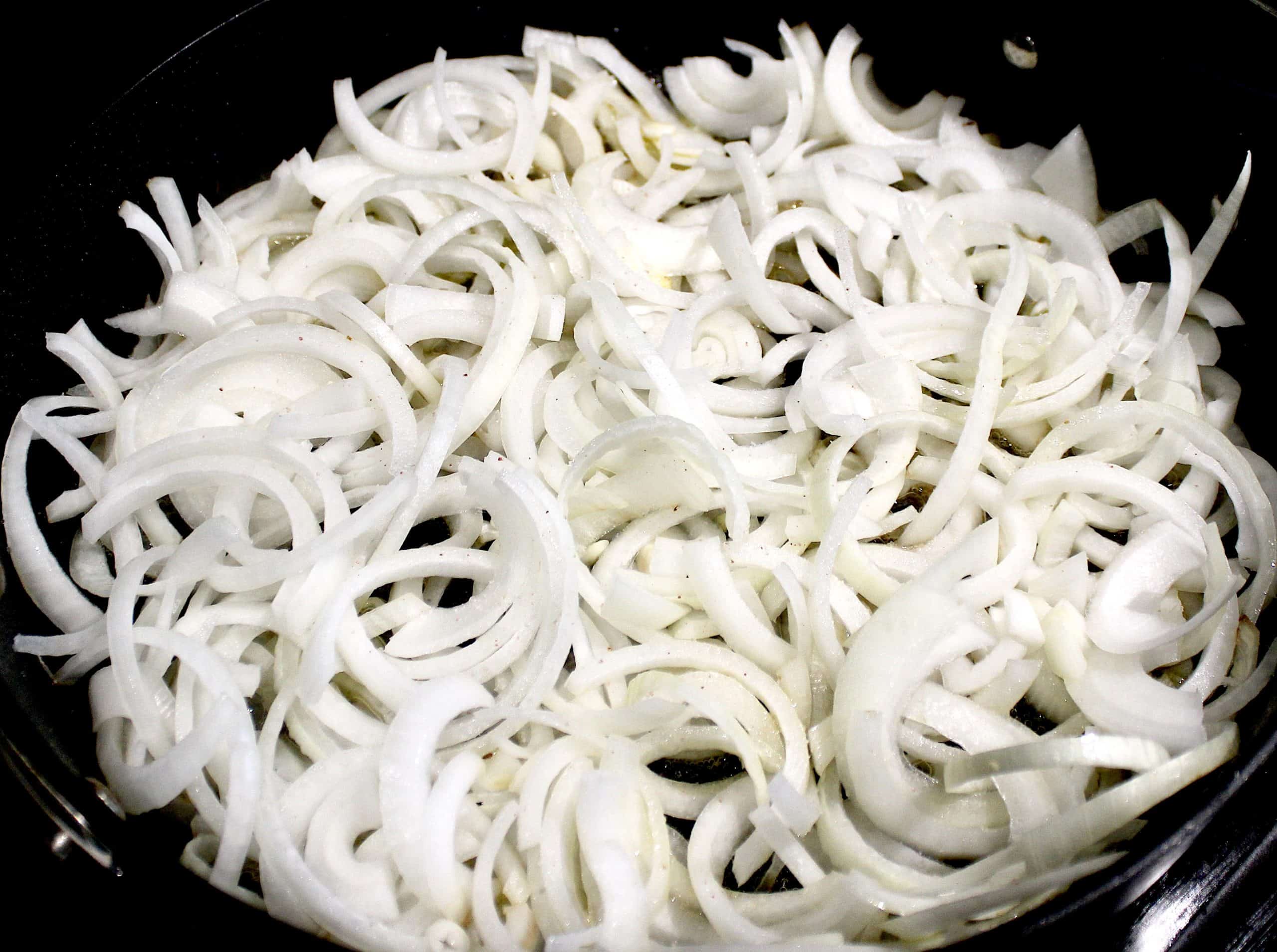 sliced onions in skillet