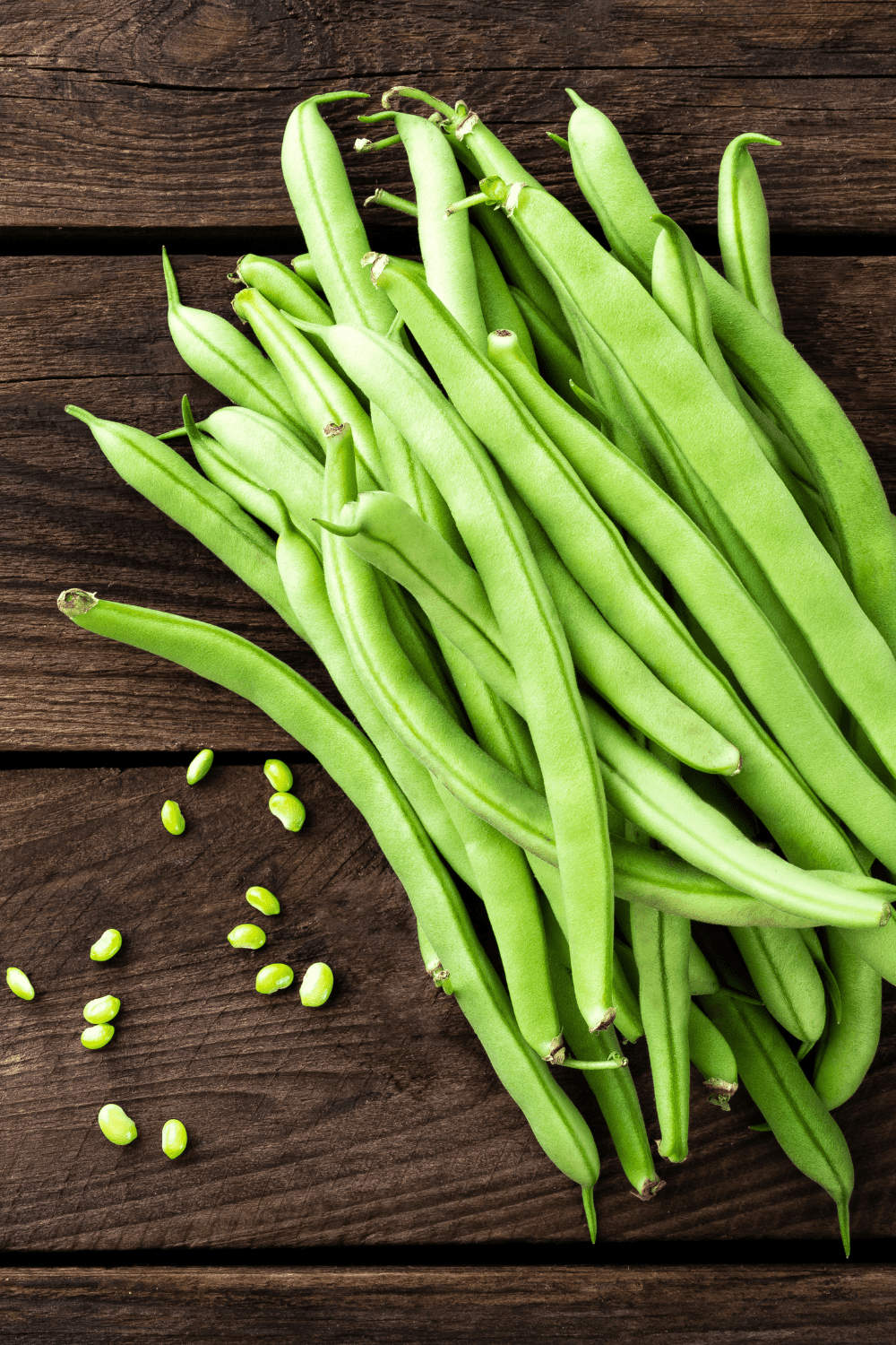 green beans on wooden board