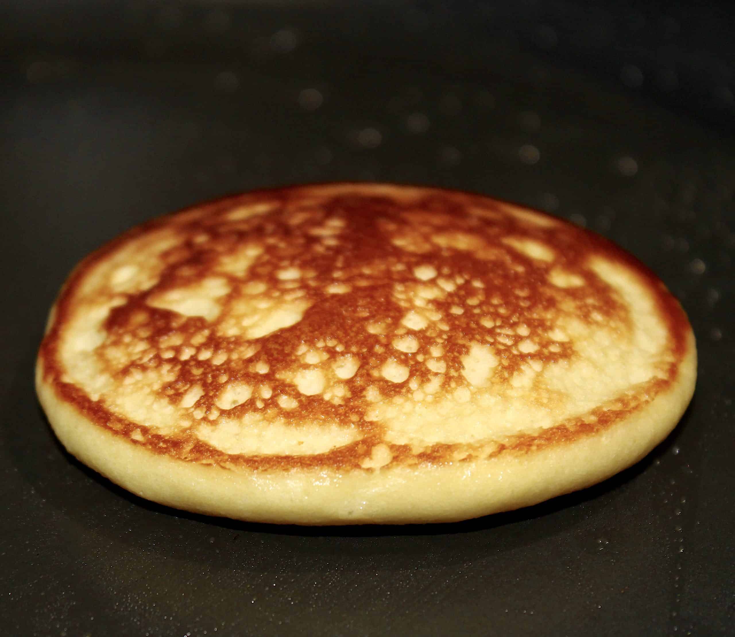 closeup of cooked pancake in skillet