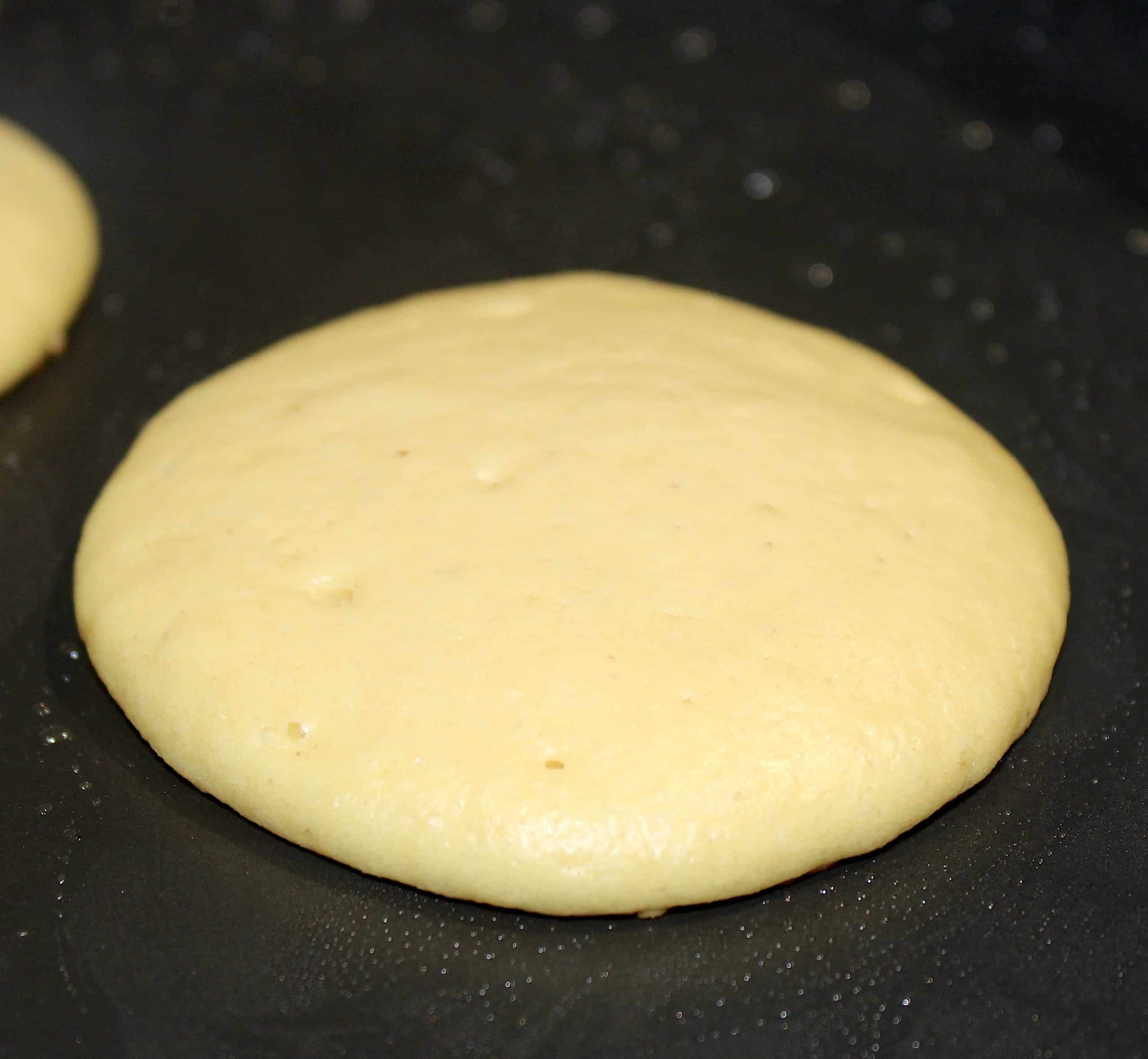 uncooked pancake in skillet