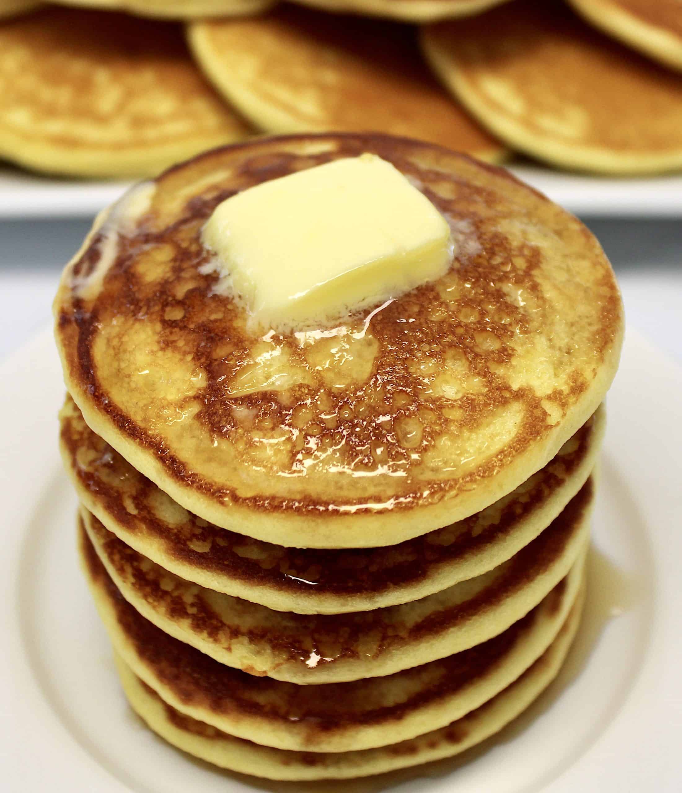 stack of pancakes with pad of butter on top