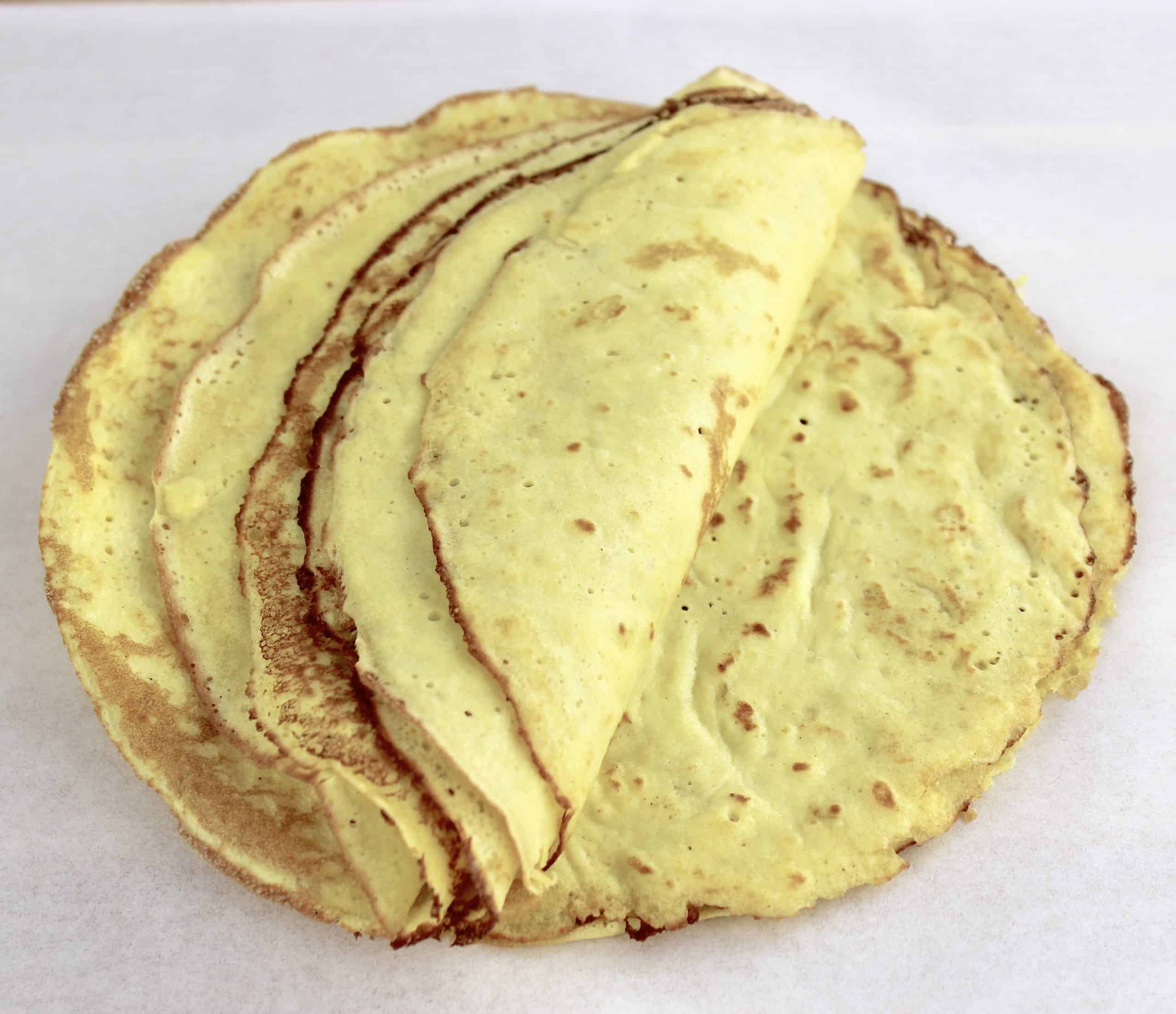 crepes in pile with some peeled back