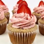 closeup of strawberry cupcake with sliced strawberry on top