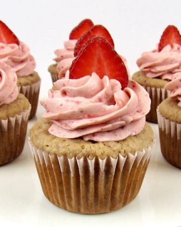 closeup of strawberry cupcake with sliced strawberry on top