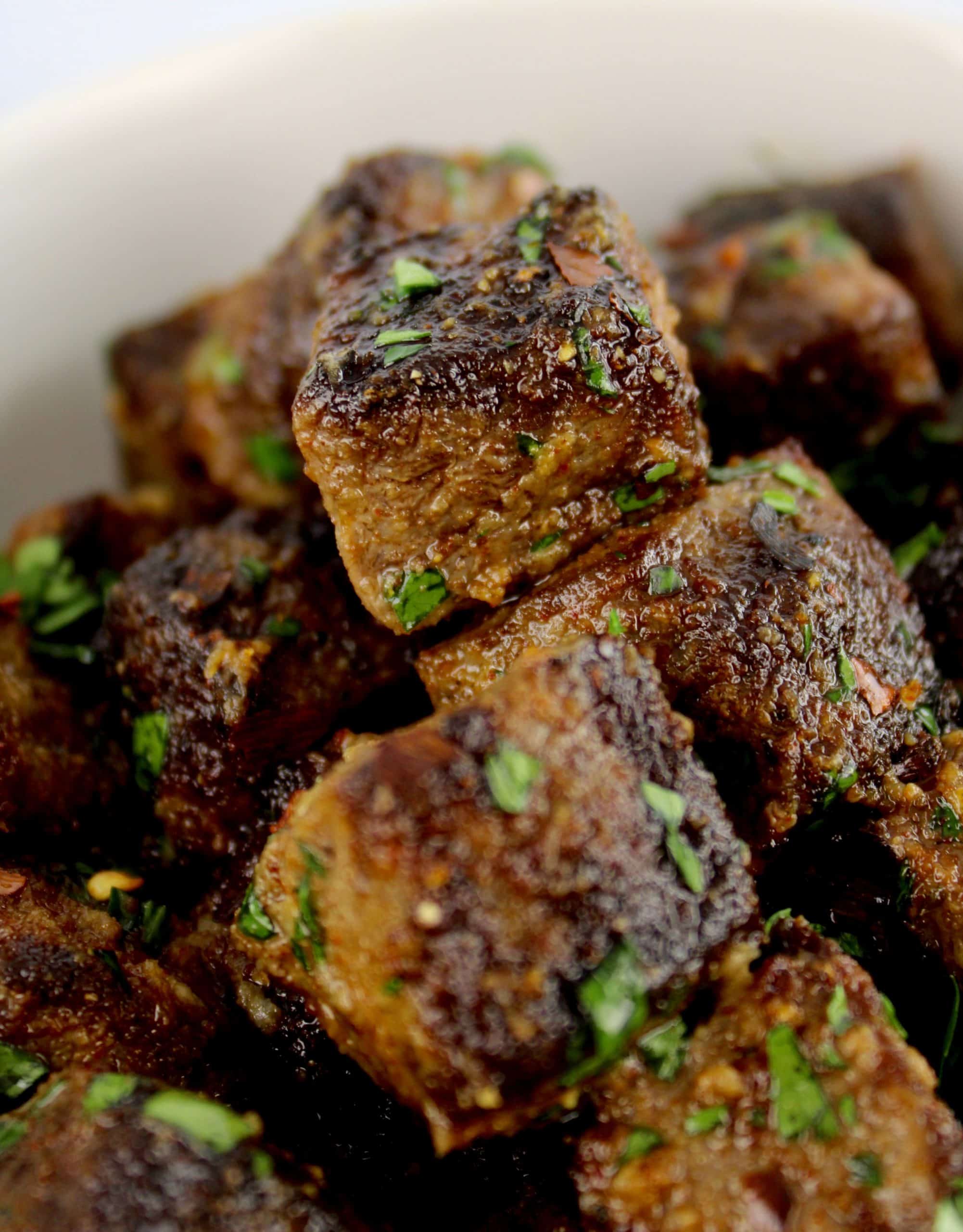 Air Fryer Steak Bites with parsley garnish