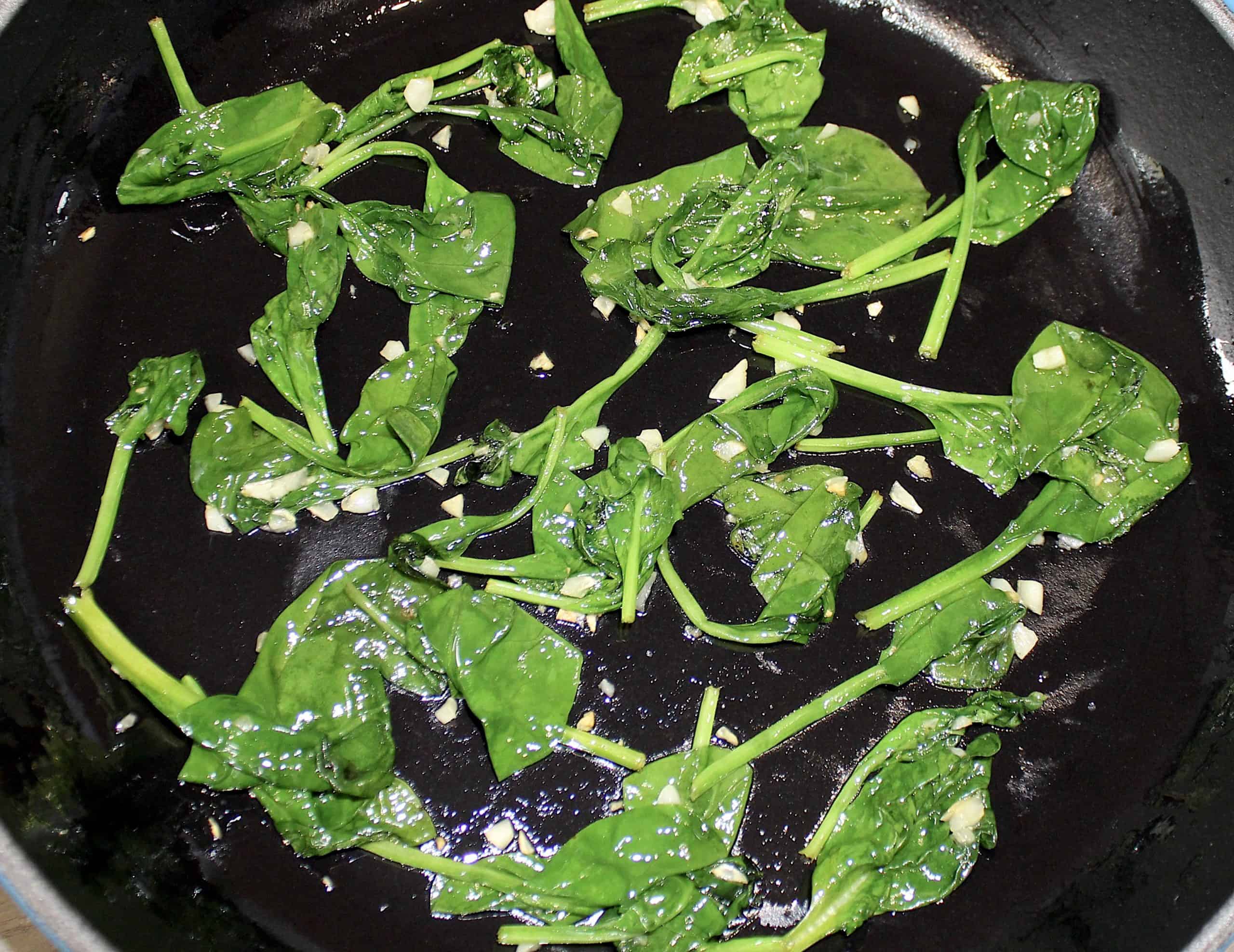 Sautéed spinach and garlic in skillet