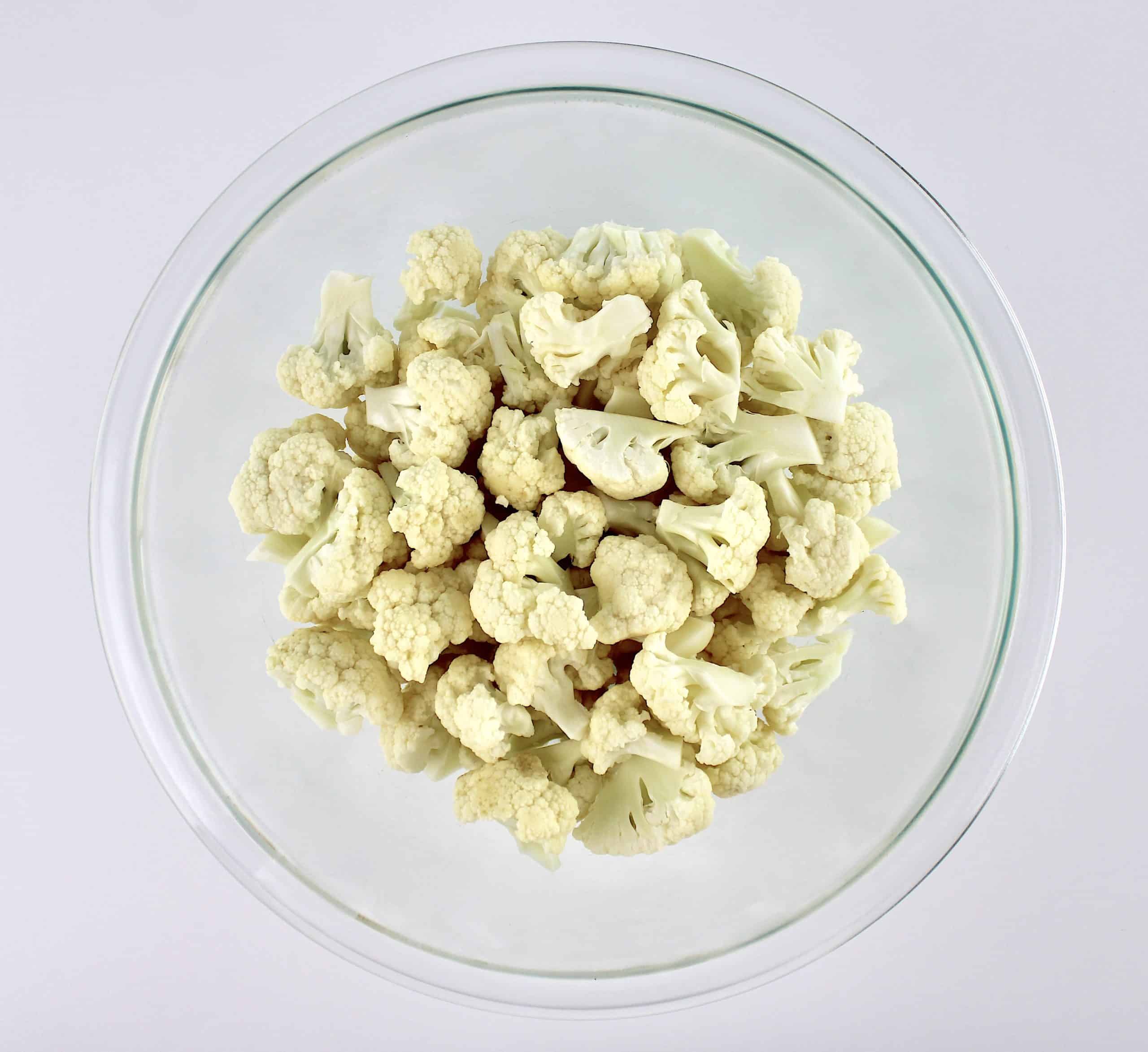 raw cauliflower florets in glass bowl
