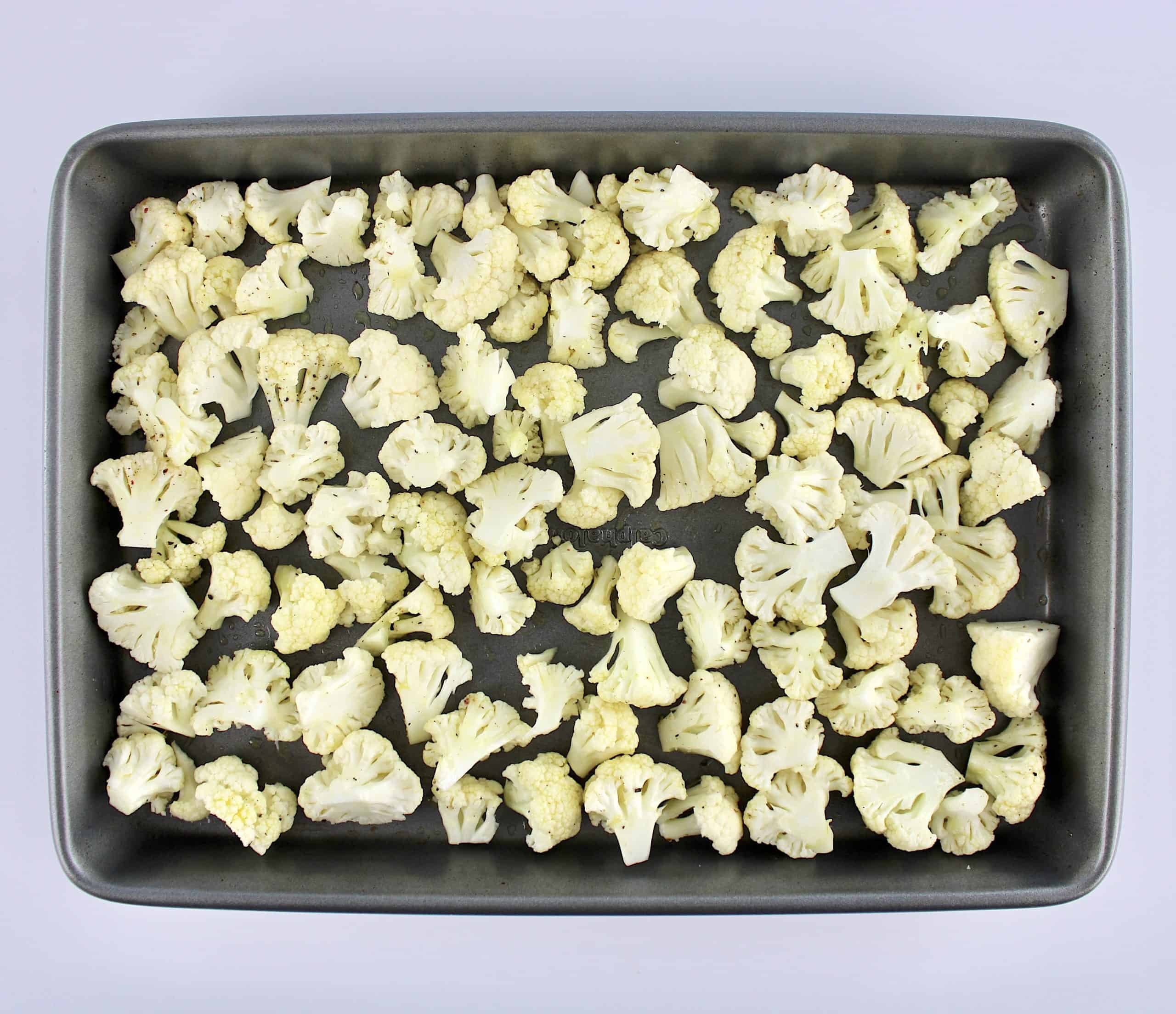 cauliflower florets on baking sheet