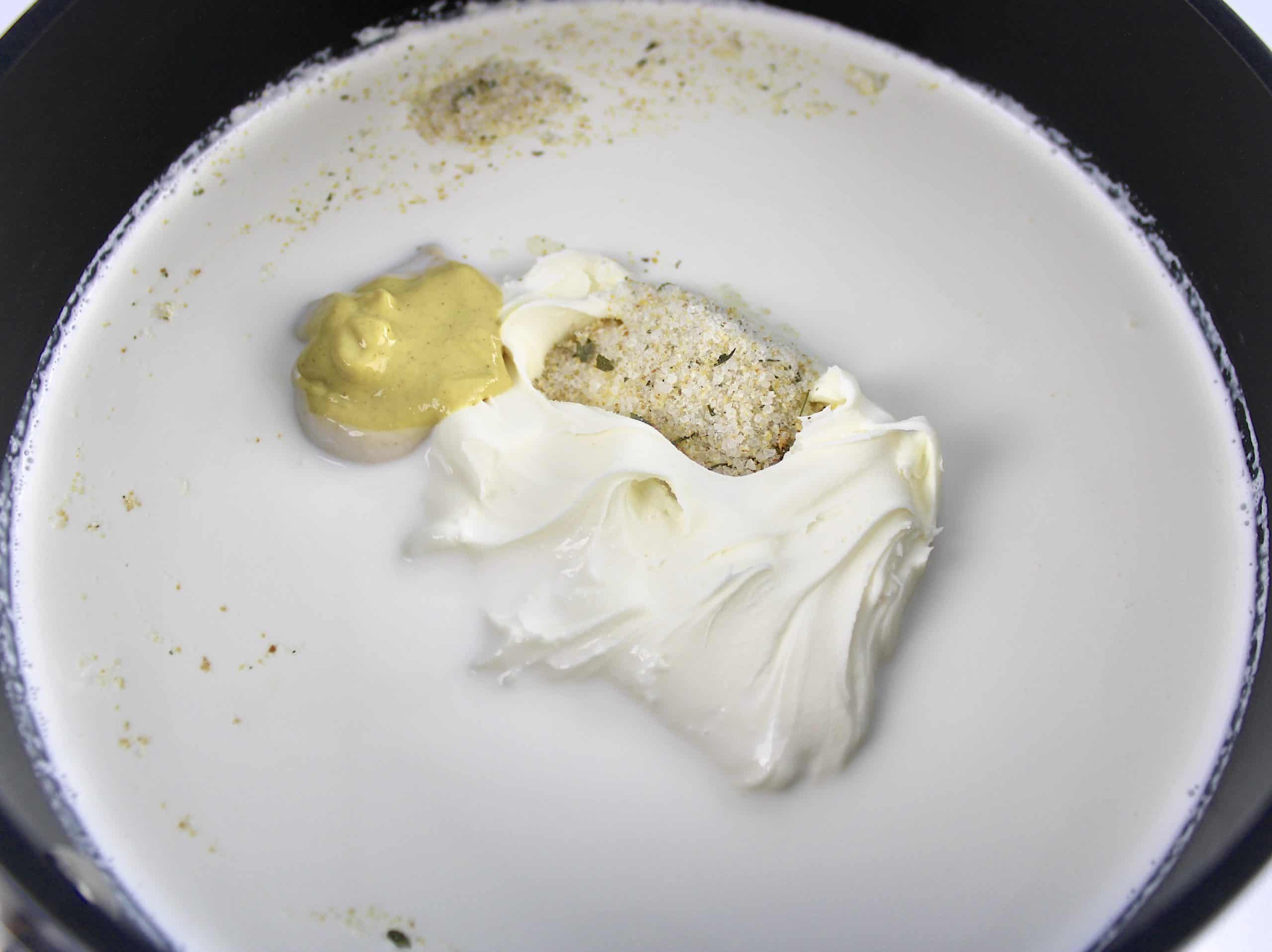 heavy cream mascarpone garlic salt and dijon mustard in saucepan unmixed