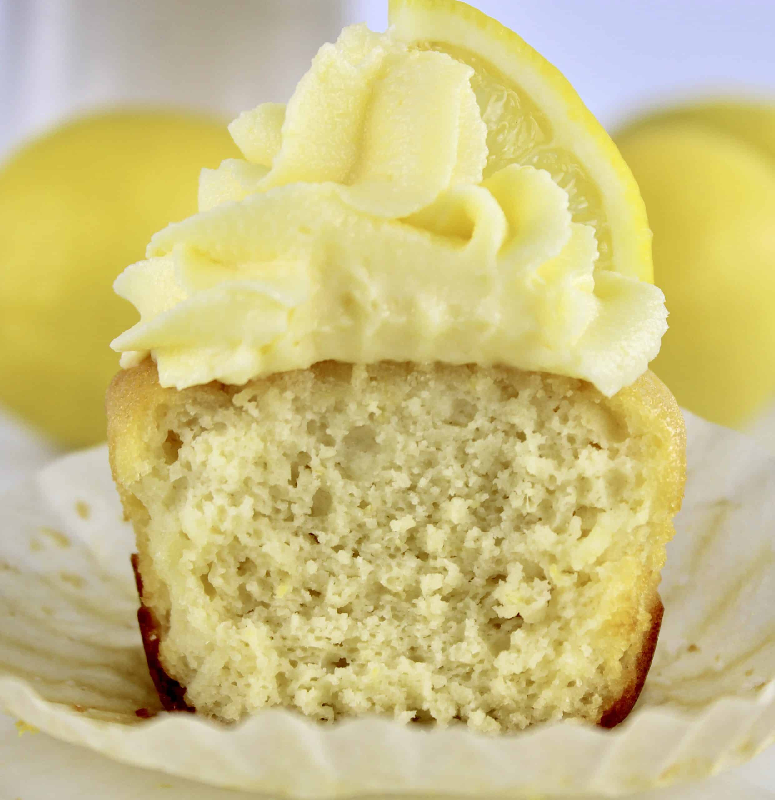lemon cupcake with frosting cut in half