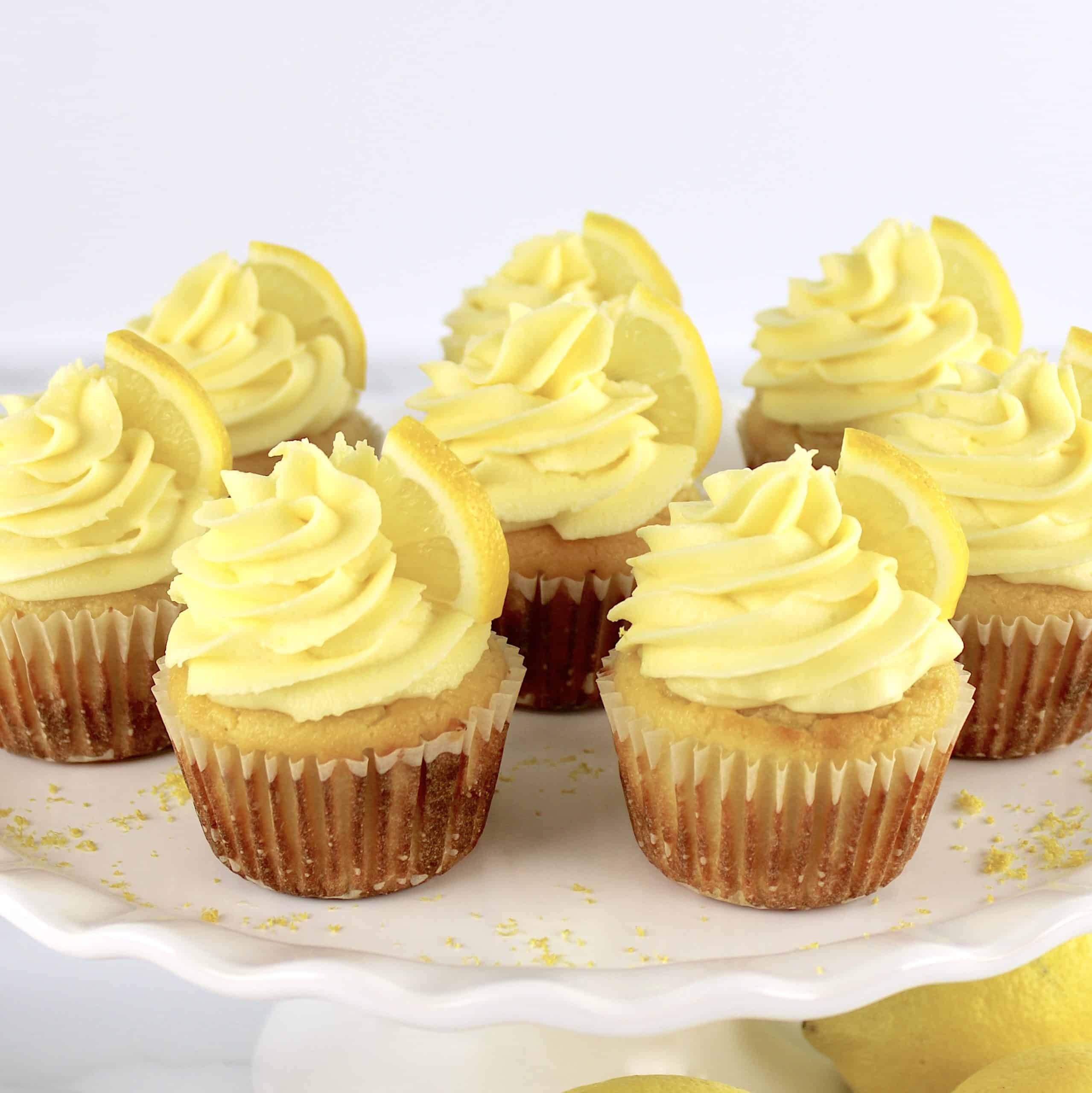 frosted Lemon Cupcakes on white cake stand