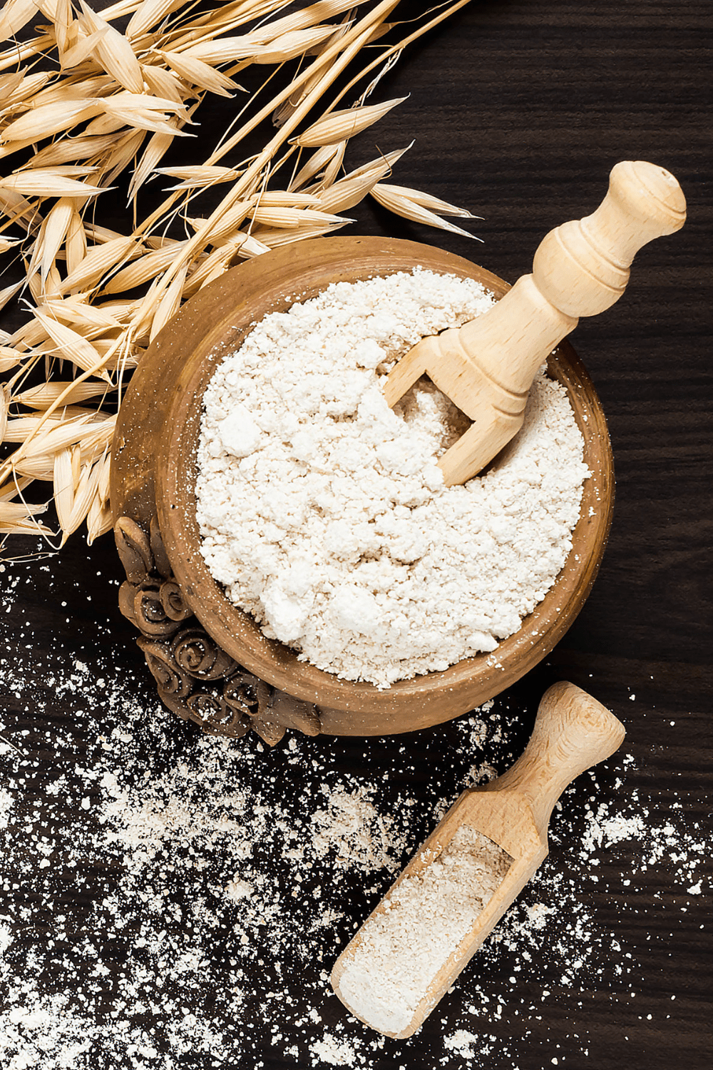 oat fiber in wooden bowl with oats on the side