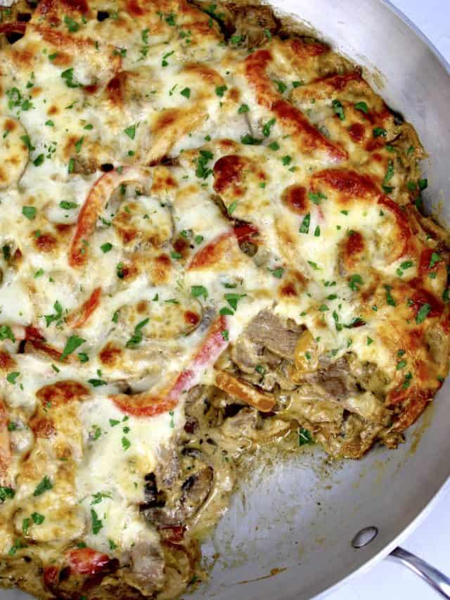 Philly Cheesesteak Casserole with piece missing