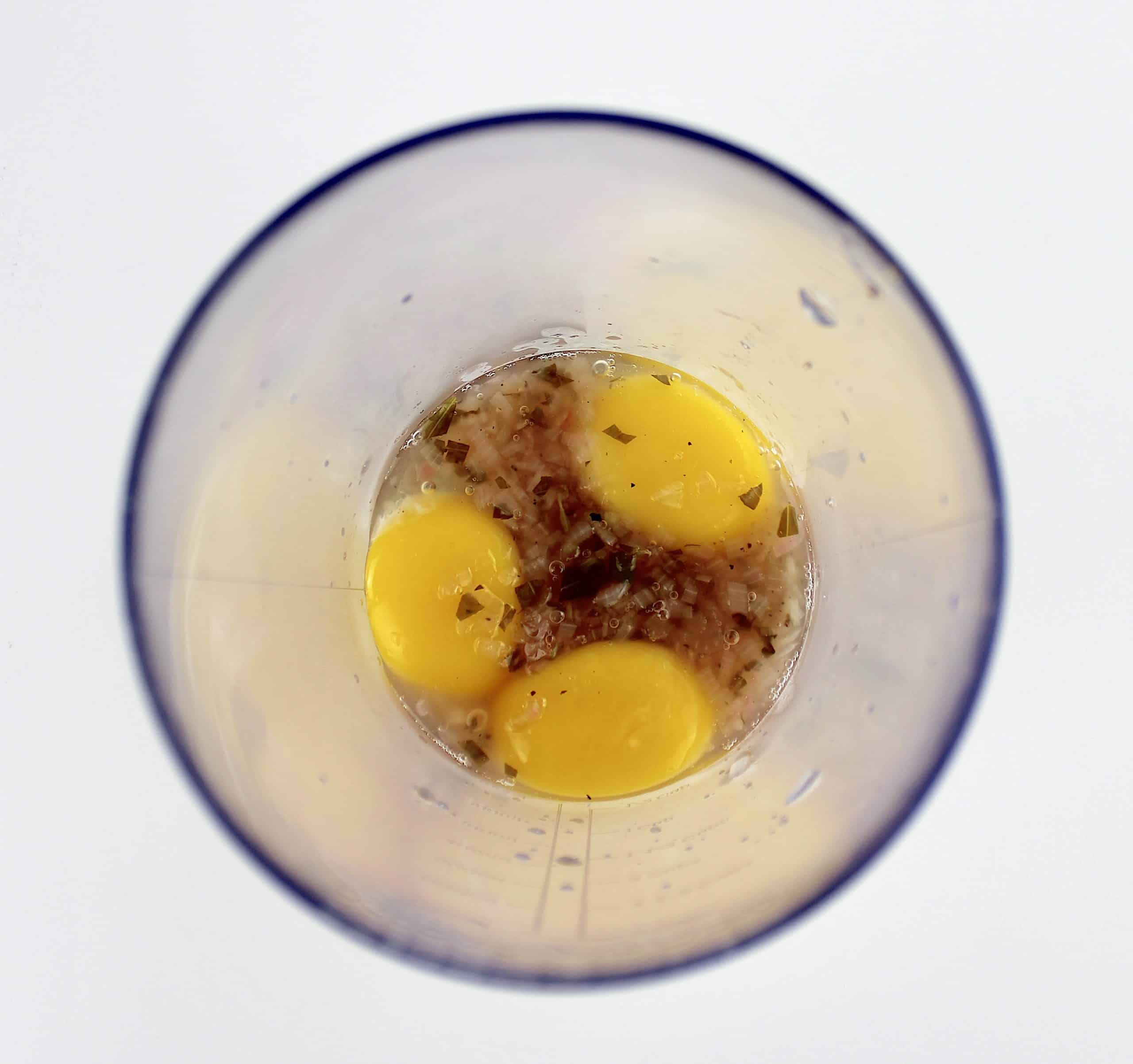 shallot wine reduction with 3 egg yolks in cup