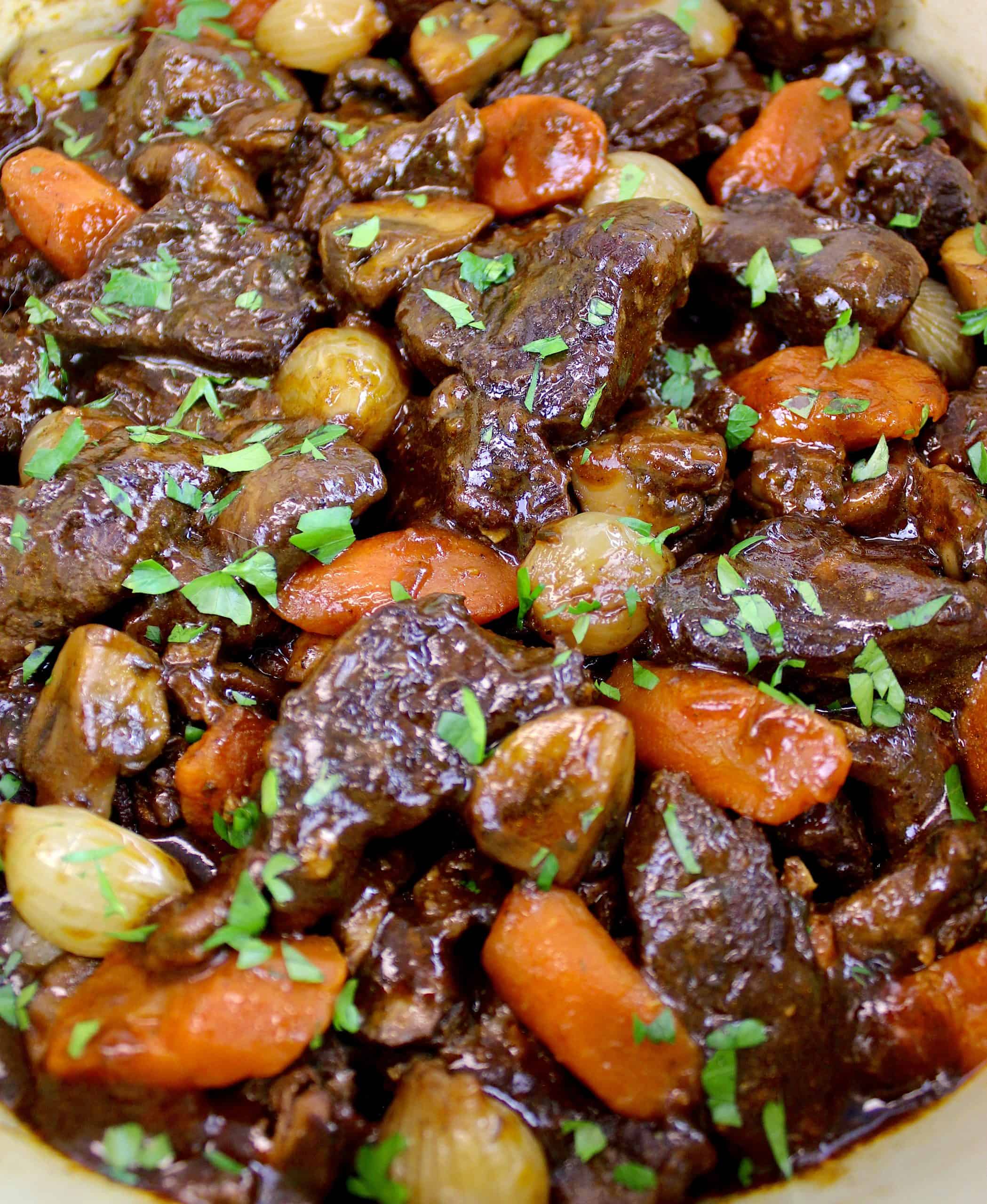closeup of Beef Bourguignon with chopped parsley garnish