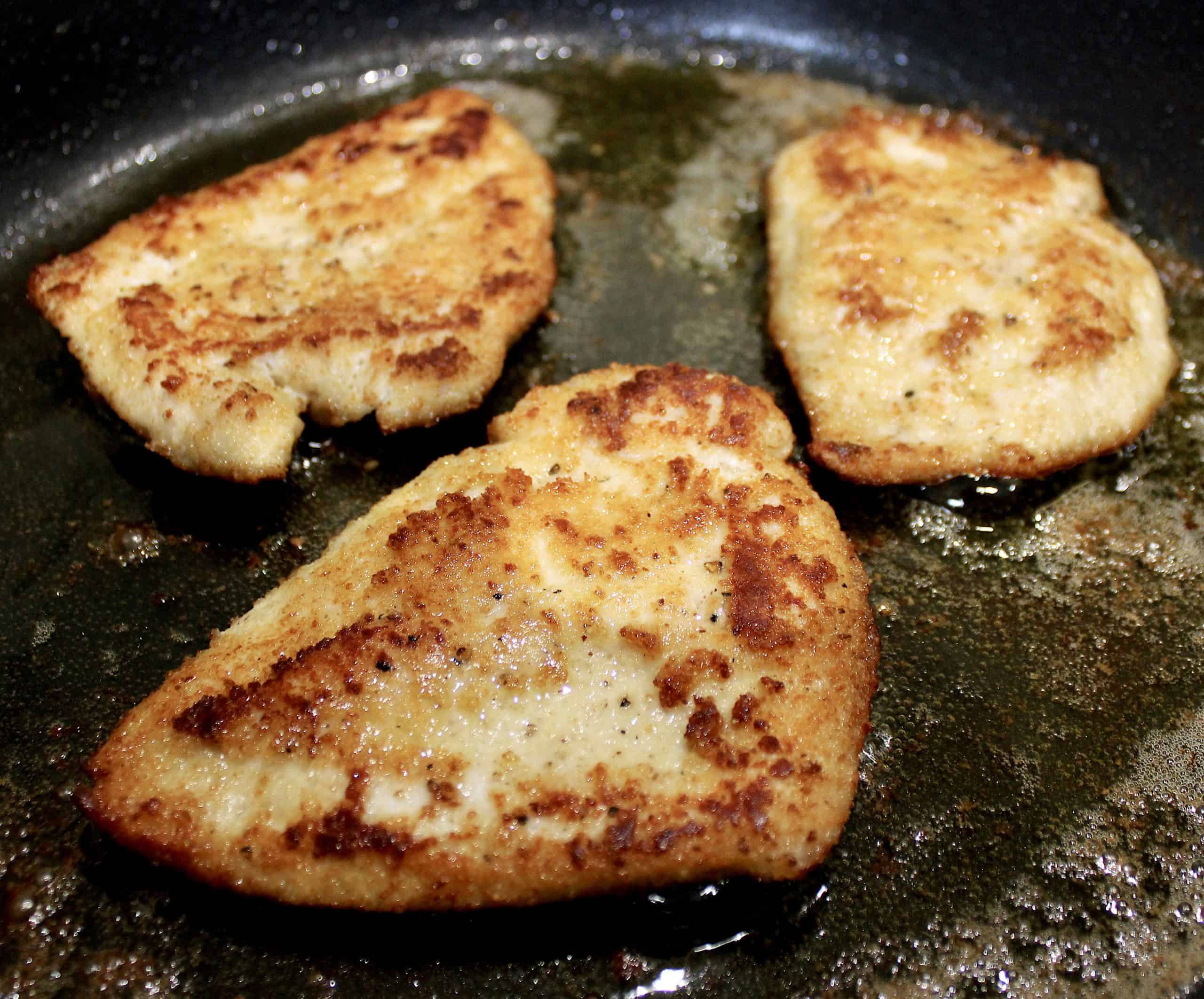 3 cooked chicken breasts in skillet