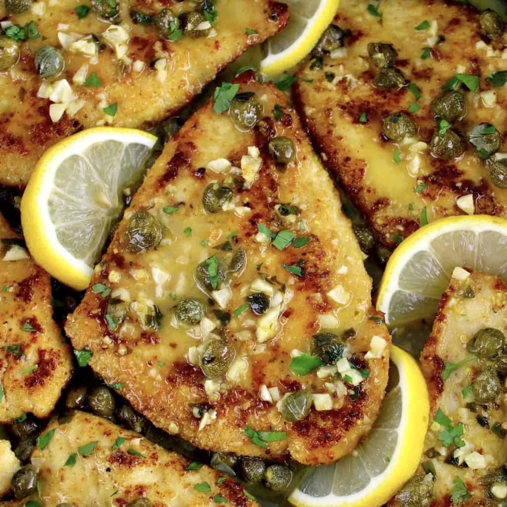 Chicken Piccata in skillet with lemon slices