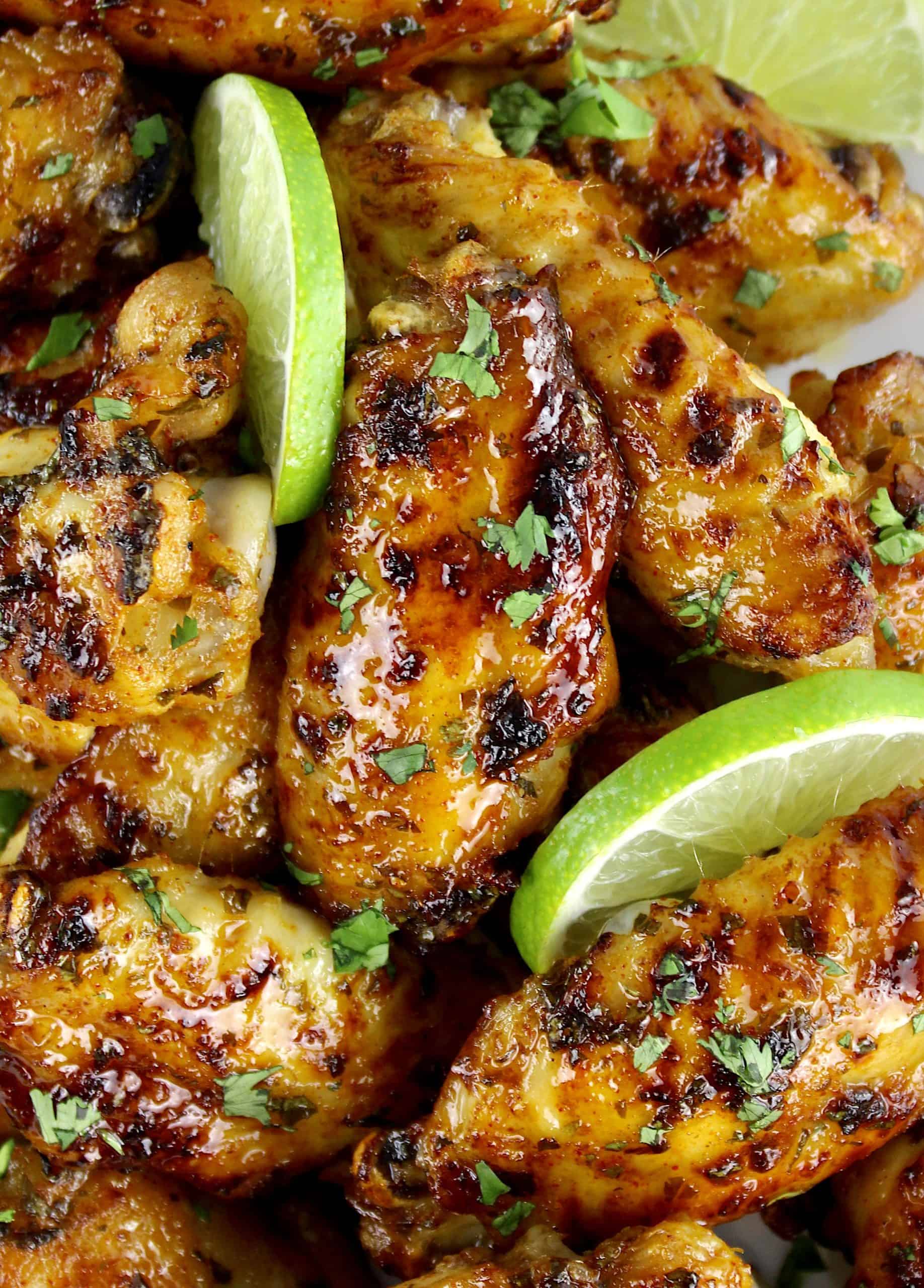 closeup of Cilantro Lime Chicken Wings with lime slices