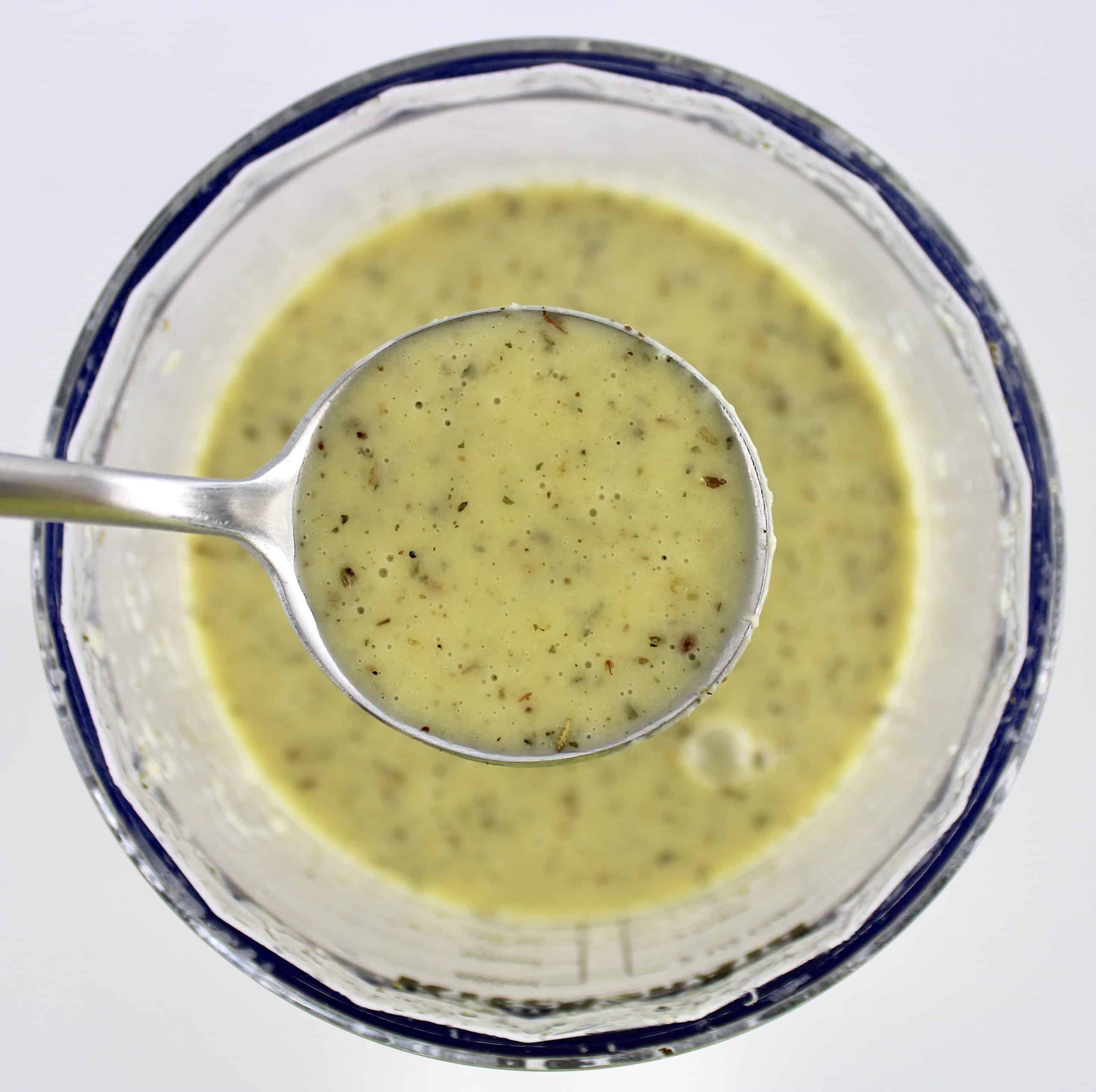 Homemade Italian Dressing in mini chopper bowl with spoonful