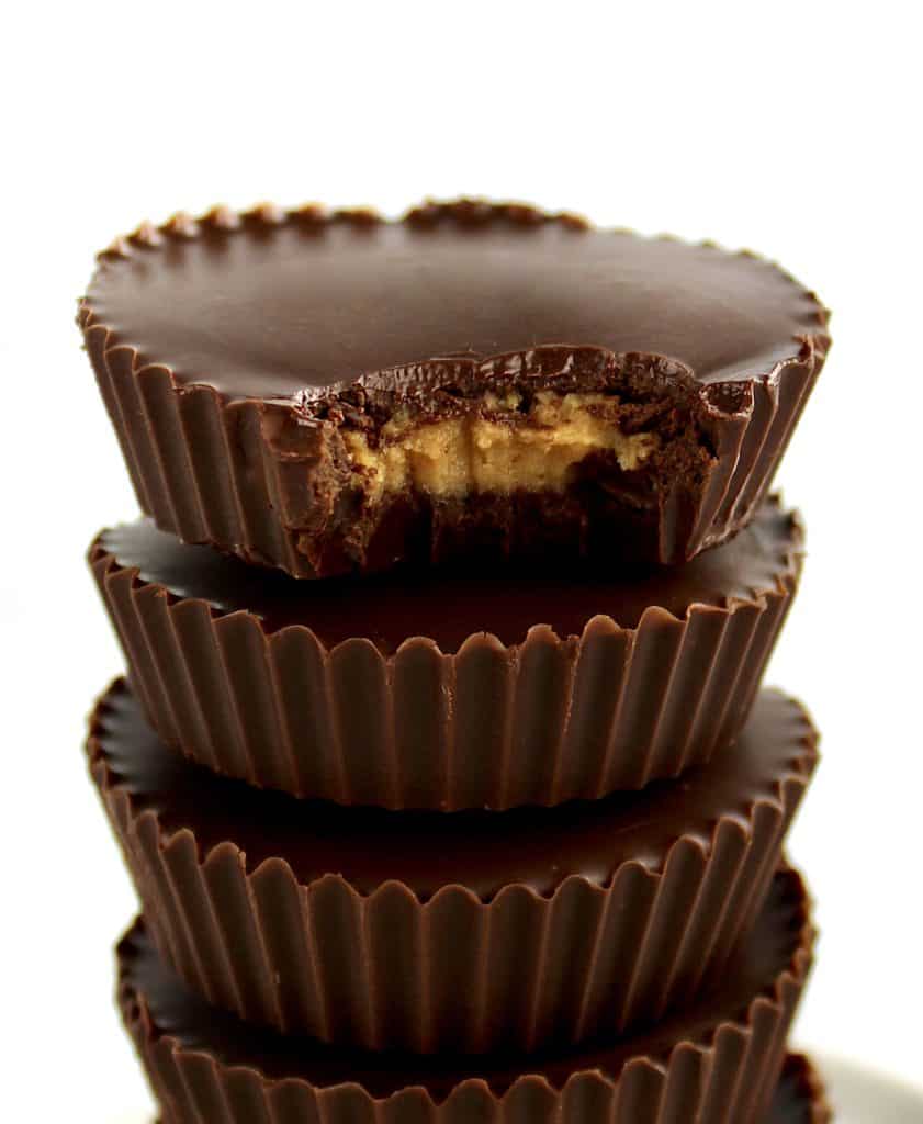 Keto Peanut Butter Cups stacked with bite missing from the top one